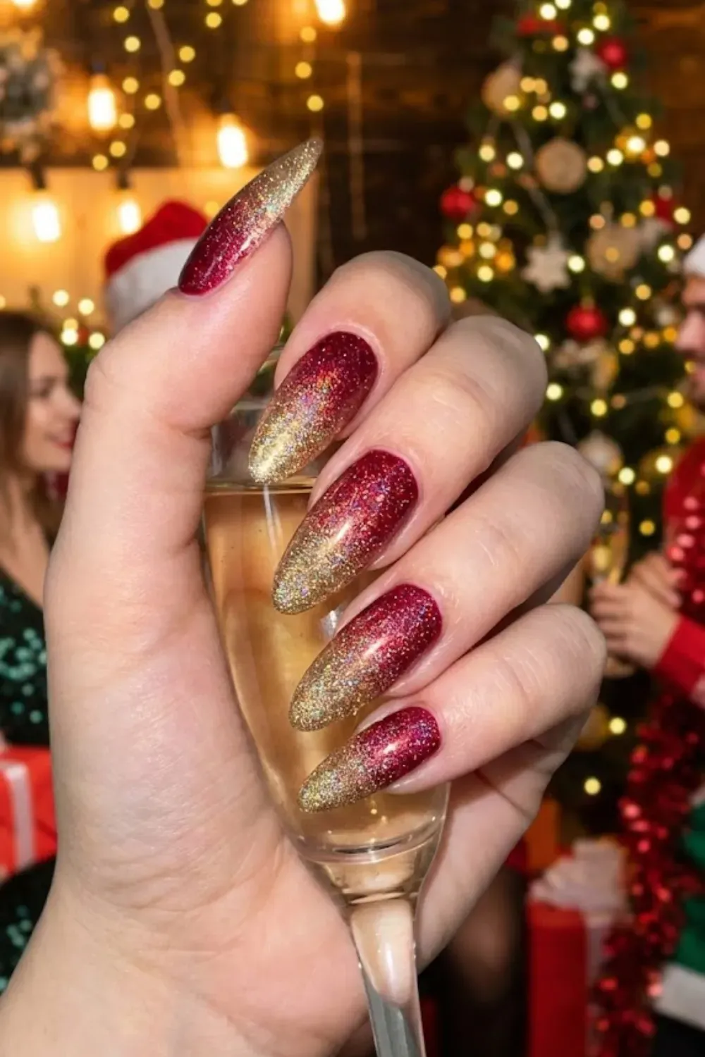 Red to Gold Glitter Ombre Holiday Nails - Festive almond nails with a fiery gradient fading from rich red to sparkling gold glitter.