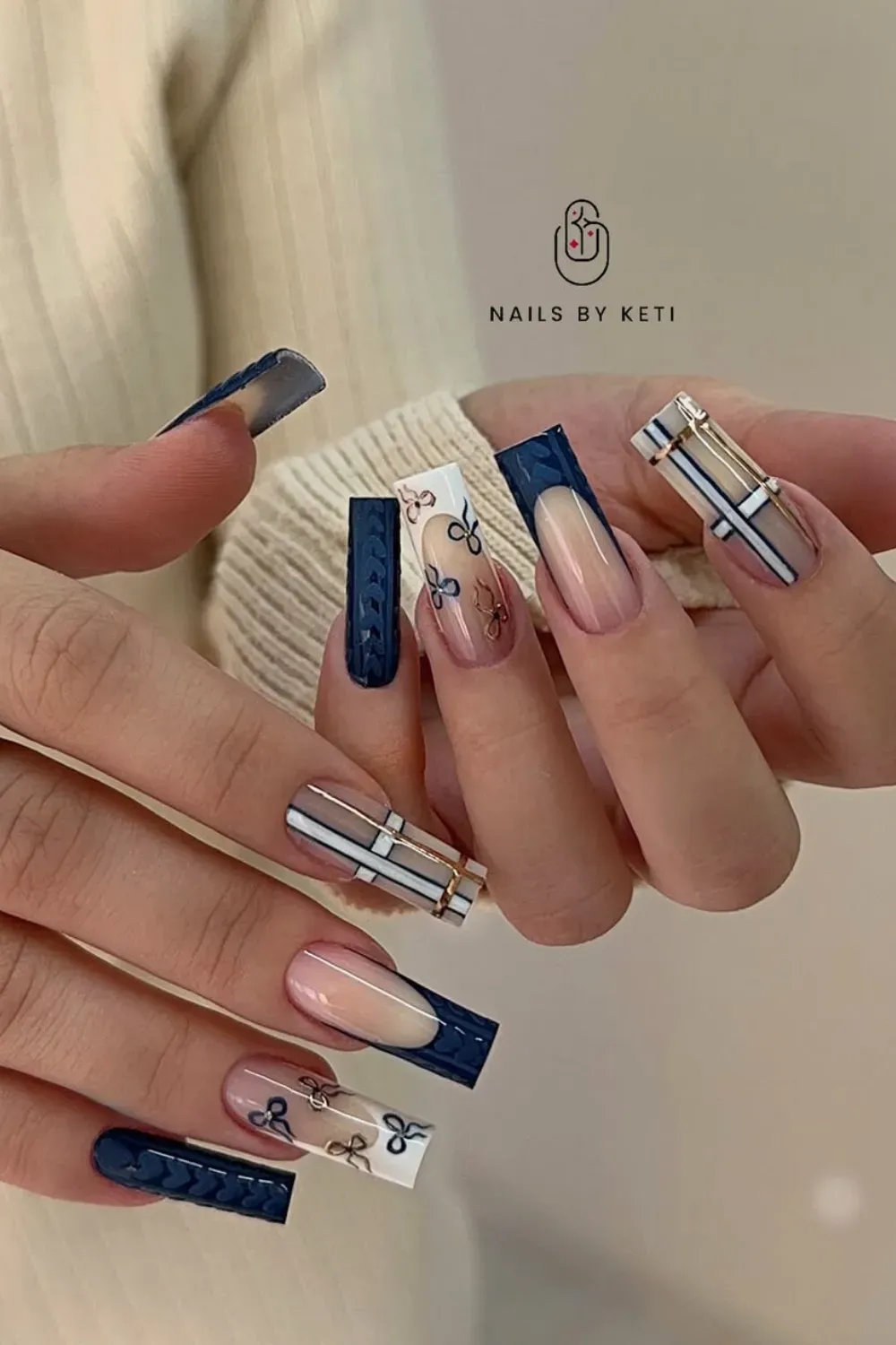 Cozy Navy Plaid and Sweater Texture Nails – Long square nails featuring intricate navy sweater knit texture, preppy plaid patterns, and French tips adorned with bows.