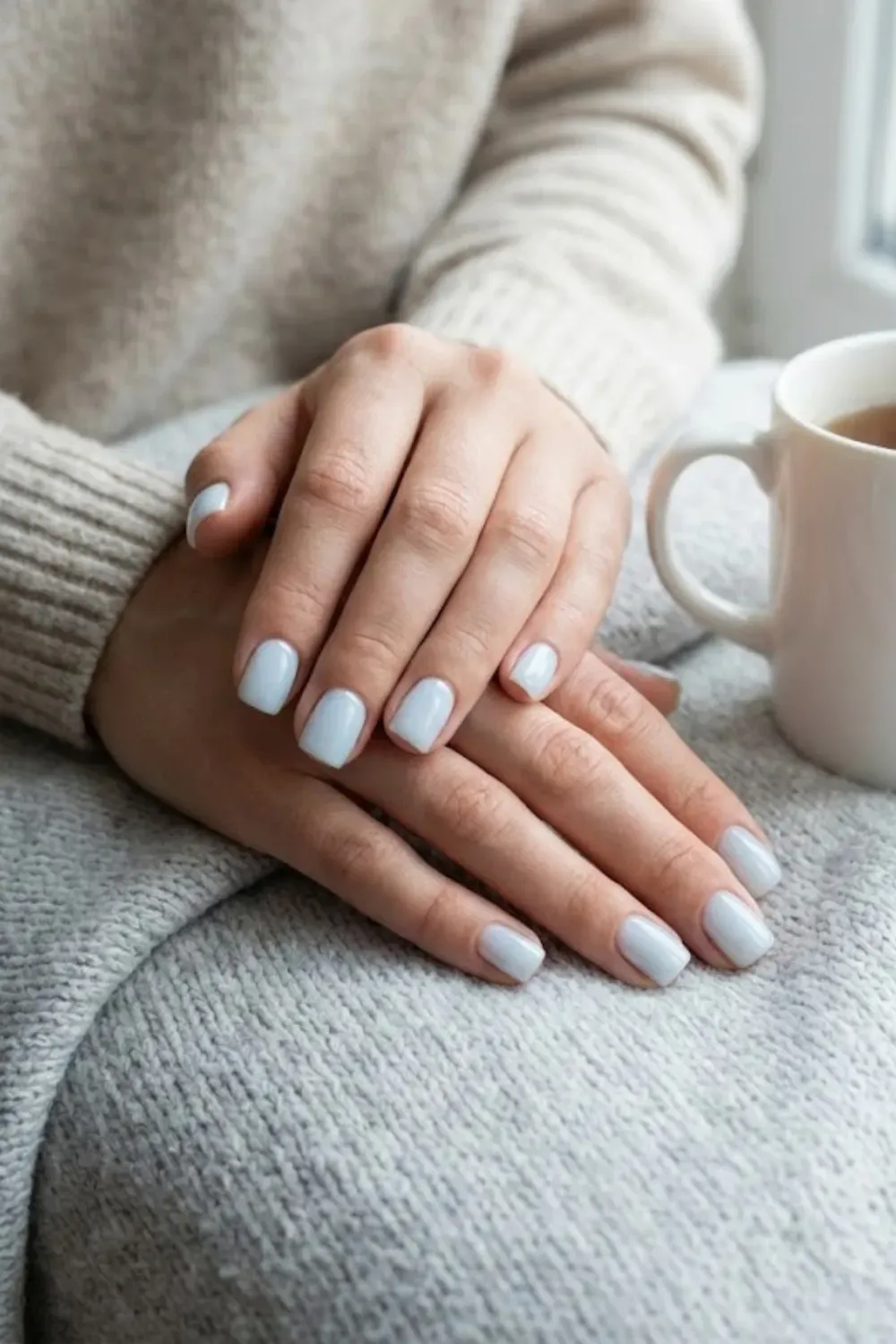 Minimalist Short Square Milky Blue Nails – Short square nails painted in a soft milky light blue shade, perfect for a practical and minimal everyday winter style.