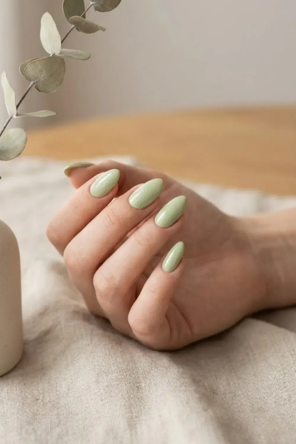 Soft sage green almond nails, earthy and organic spring color.