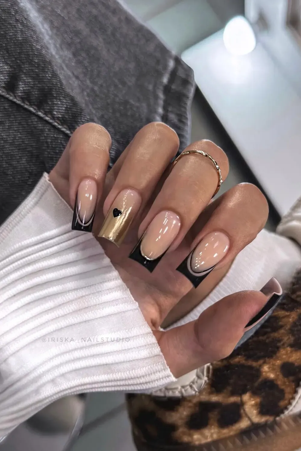 Black and Gold French Tips with Micro Heart – Square nails with sophisticated black and gold french tips and a single micro heart.