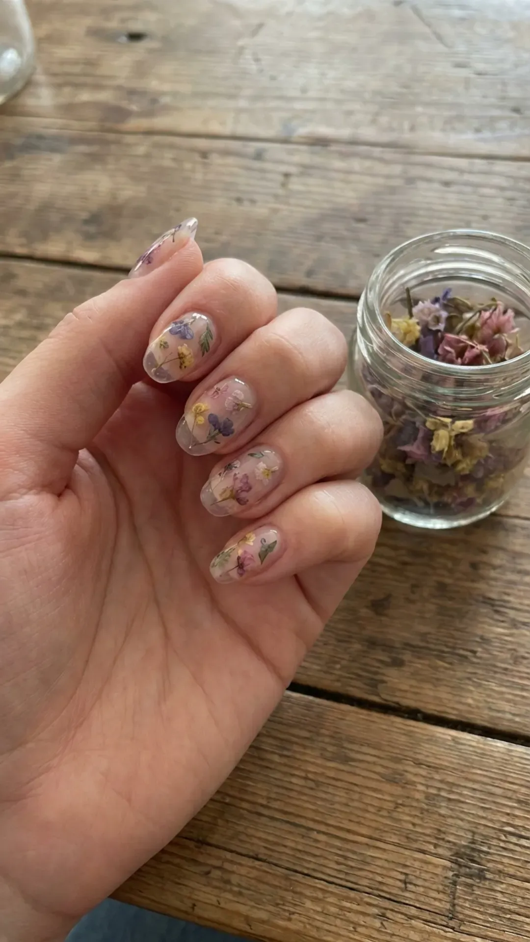 clear gel March nails with pressed dried flowers
