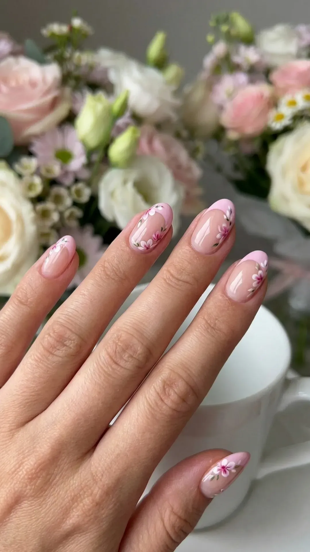 French tip March nails with small floral accents