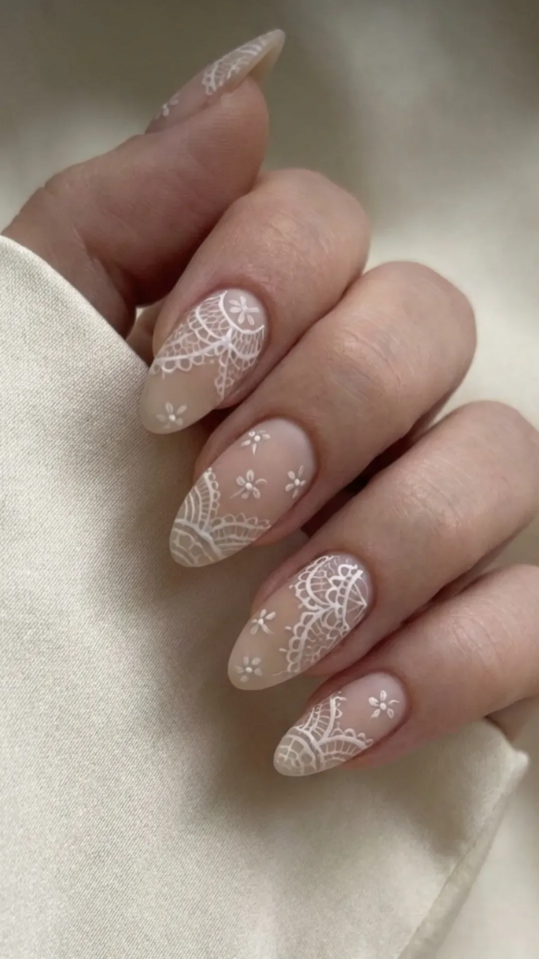 Lace nail art gorgeous nails on nude base, delicate white pattern
