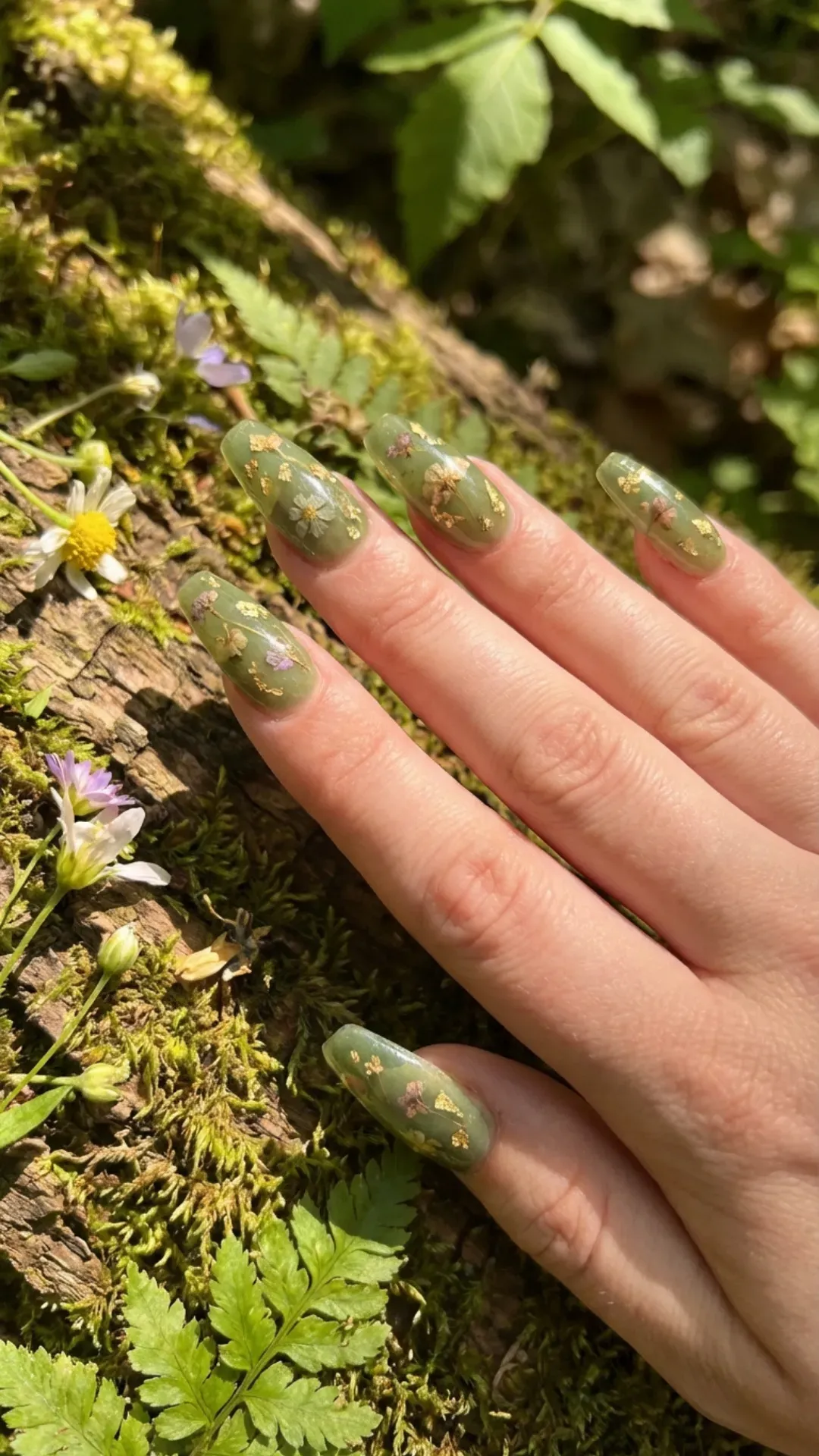 Translucent green nails with pressed flower effect nature style 