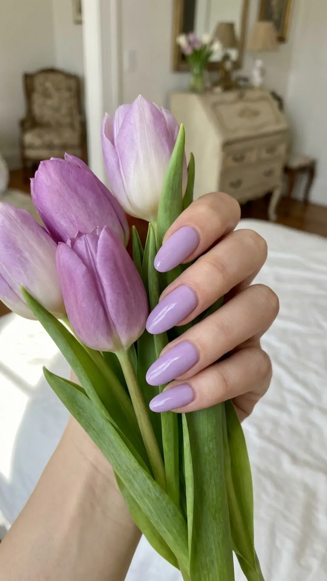 glossy lavender March nails on oval shape in soft spring light