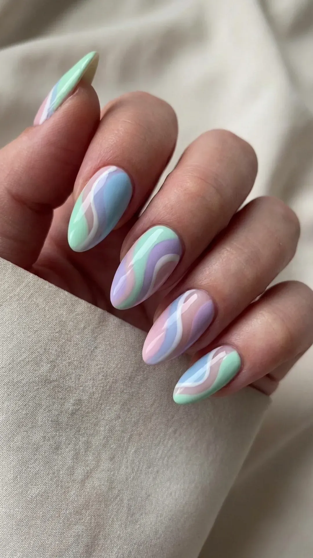 abstract pastel swirl March nails design