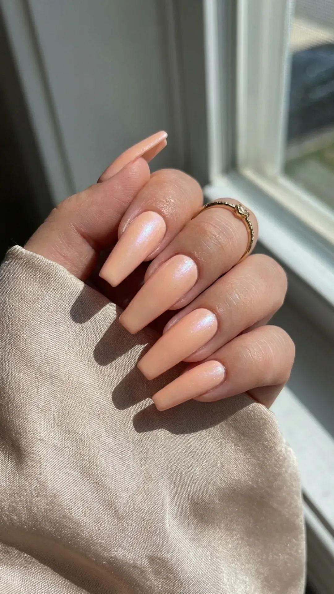 peach pastel shimmer March nails on coffin shape