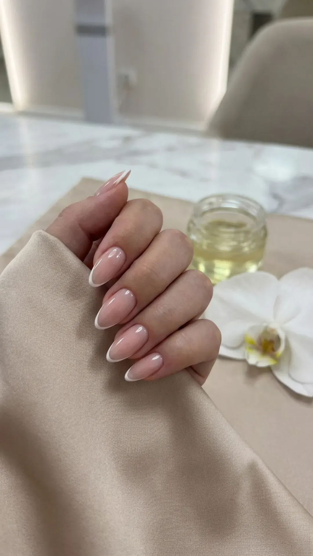 clear pink almond nails with thin French tips