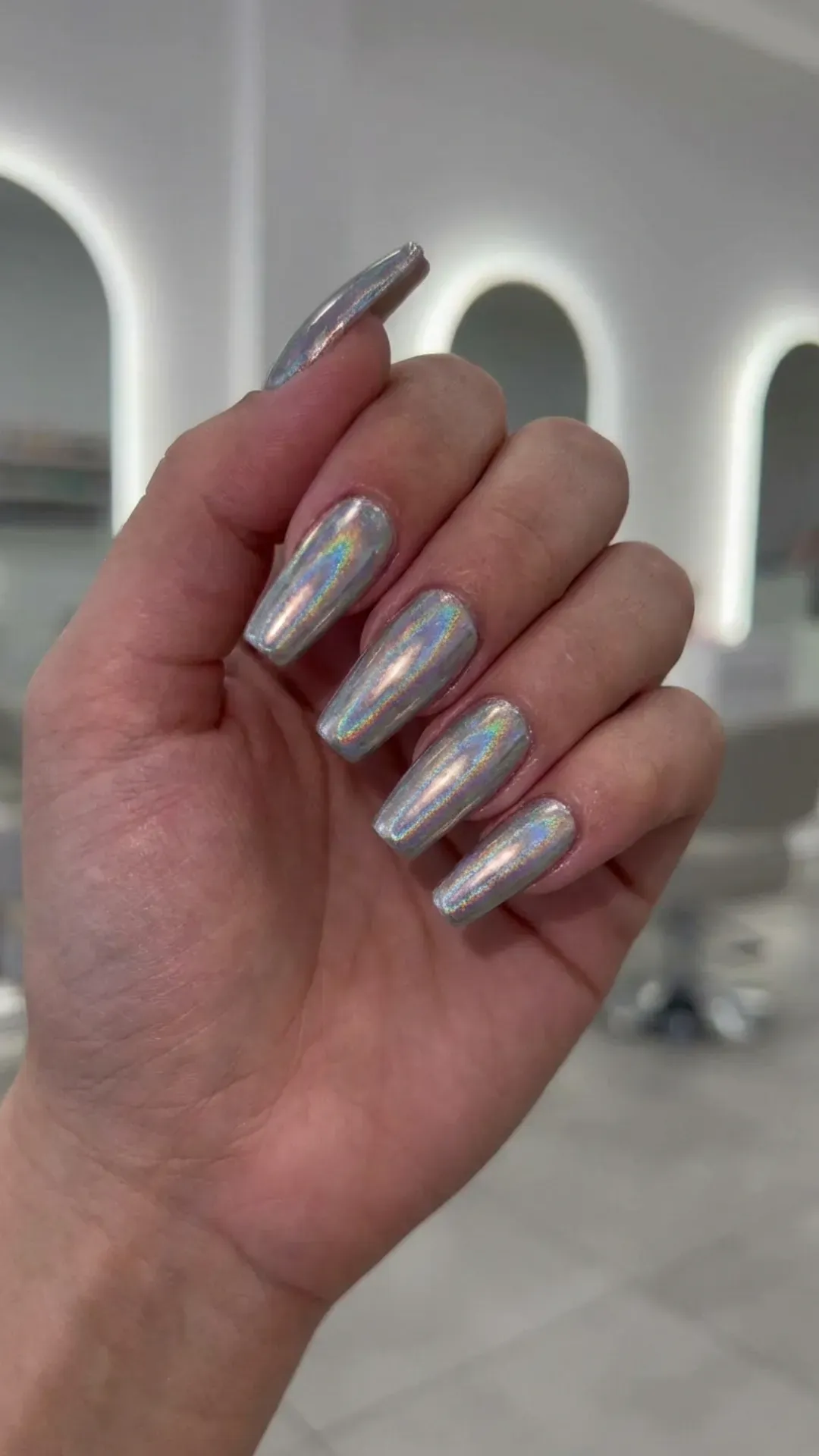 Holographic chrome gorgeous nails reflecting rainbow light