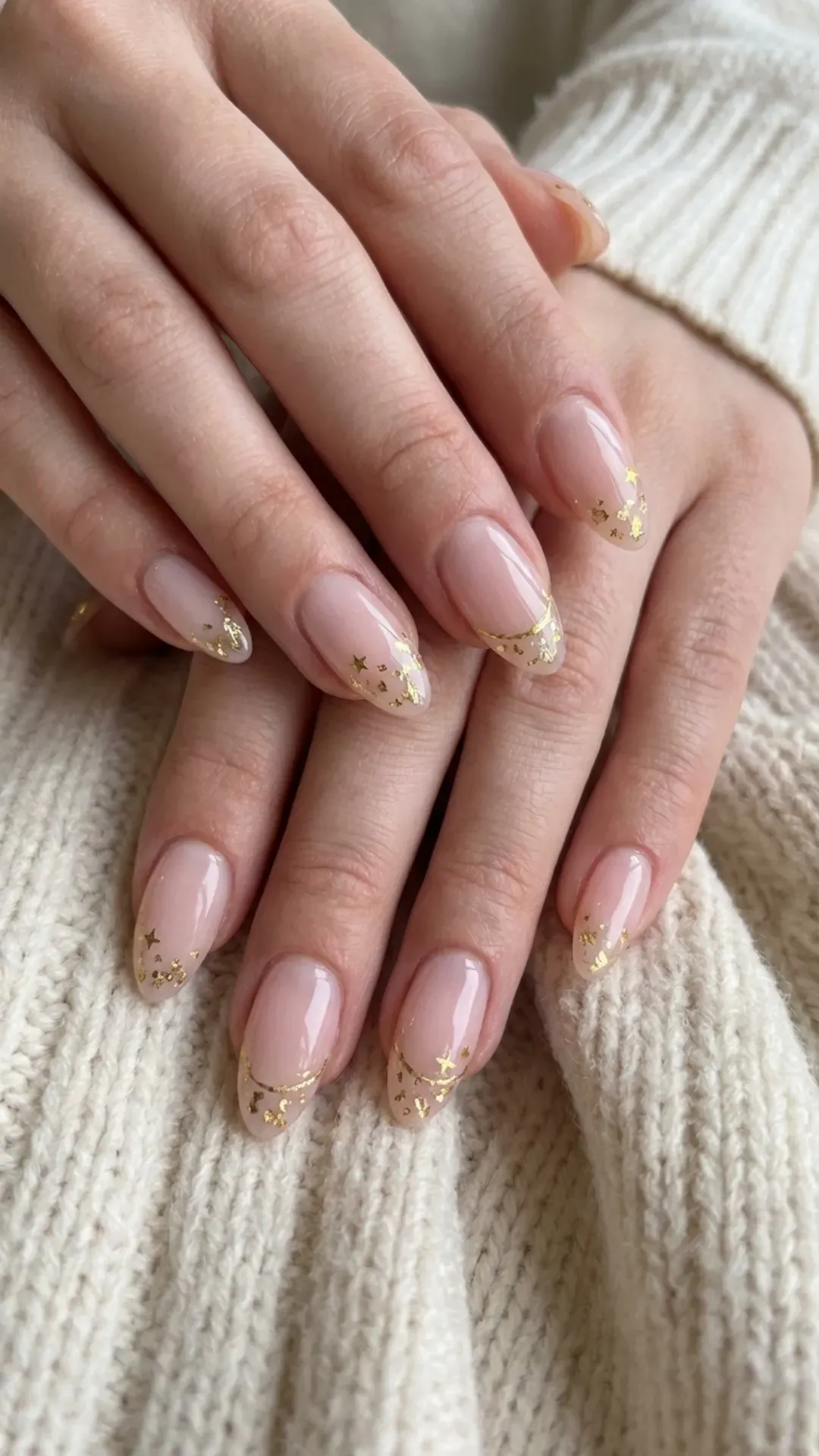 pale pink March nails with thin gold accent lines