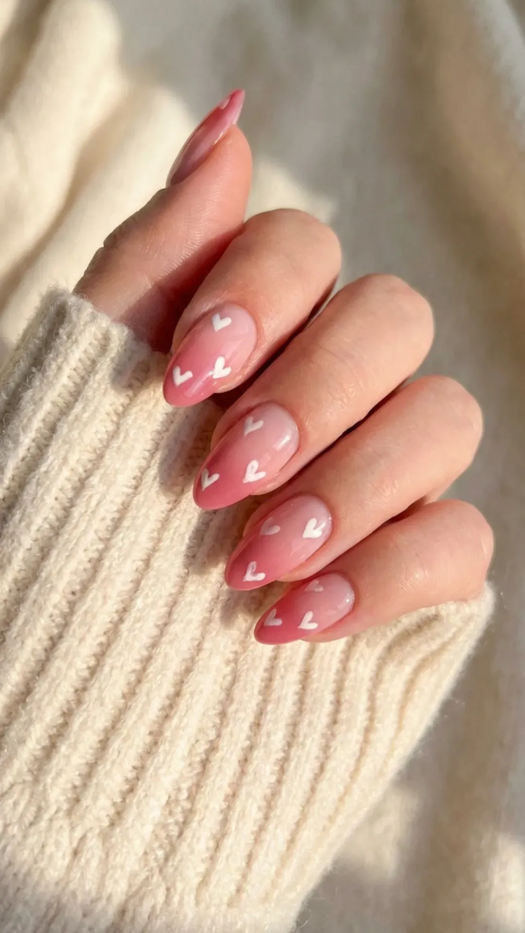 pink ombre nails with heart design