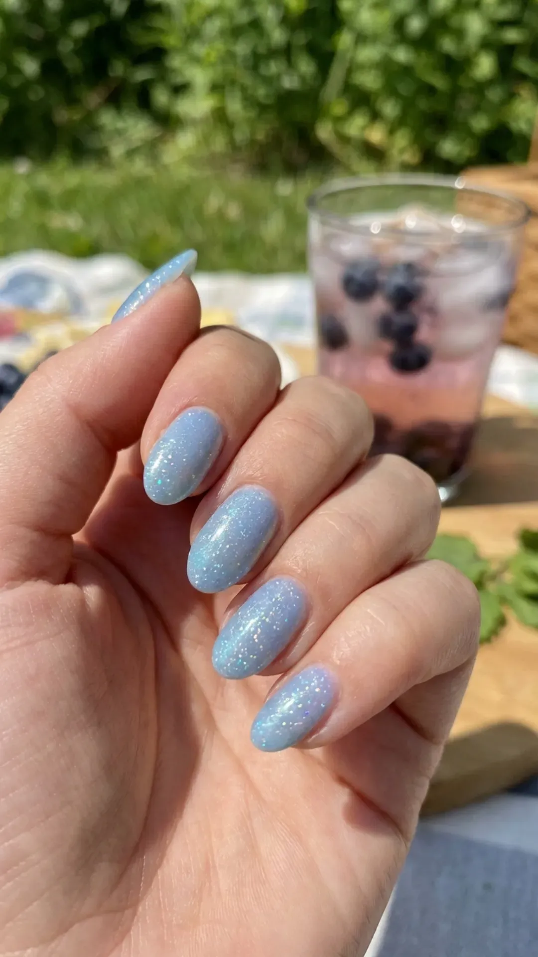Sparkling blueberry milk glitter nails with subtle shimmer, reflecting the joyful sparkle of a sunny summer day