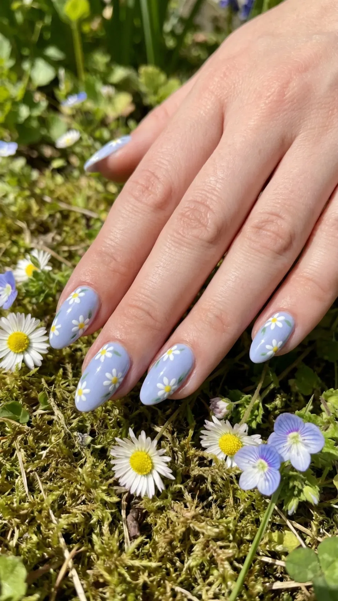 Delicate blueberry milk floral nails adorned with white daisy patterns, evoking the charm of a summer garden
