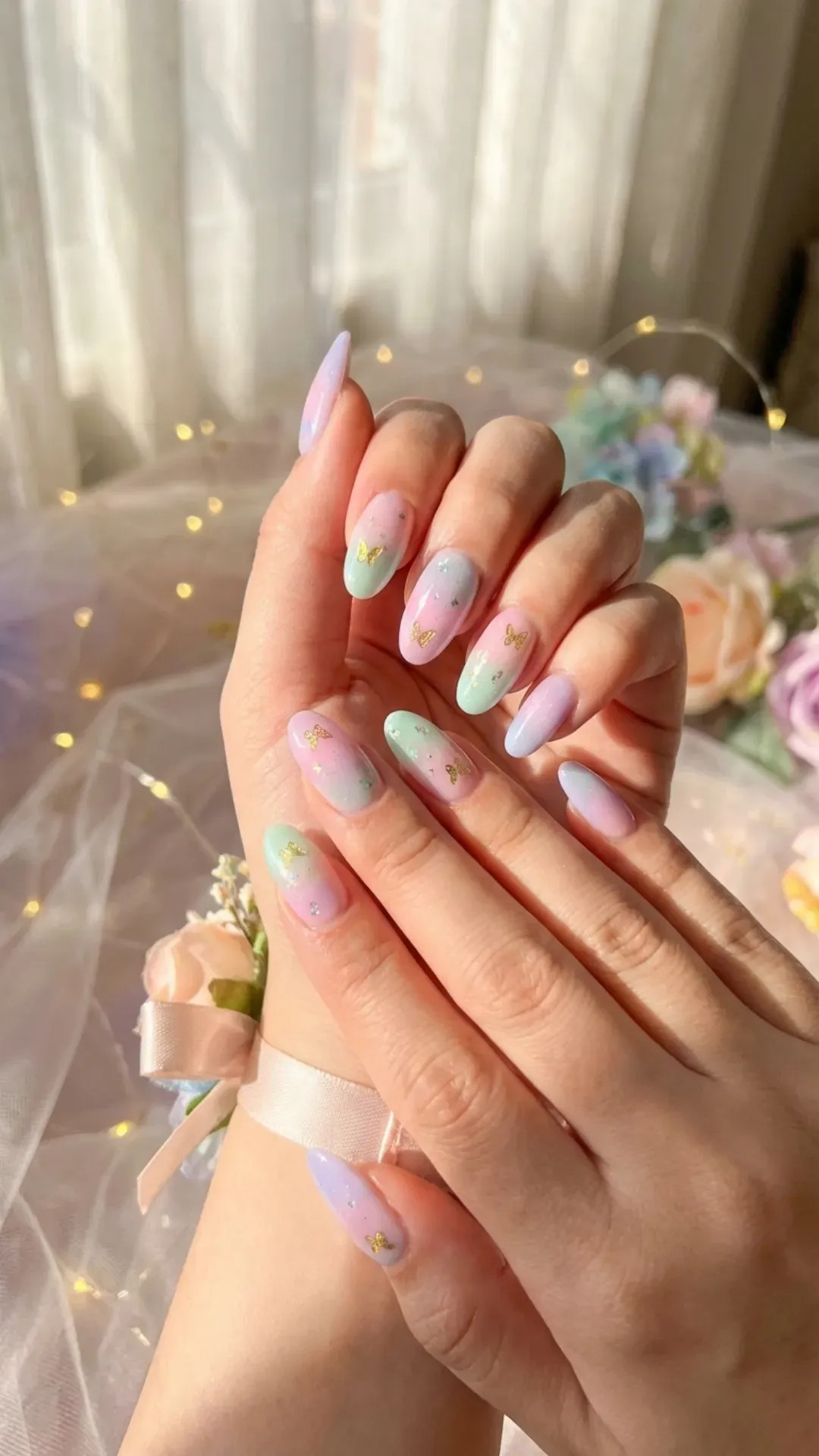 Pastel ombre prom nails with butterfly decals, dreamy feminine manicure