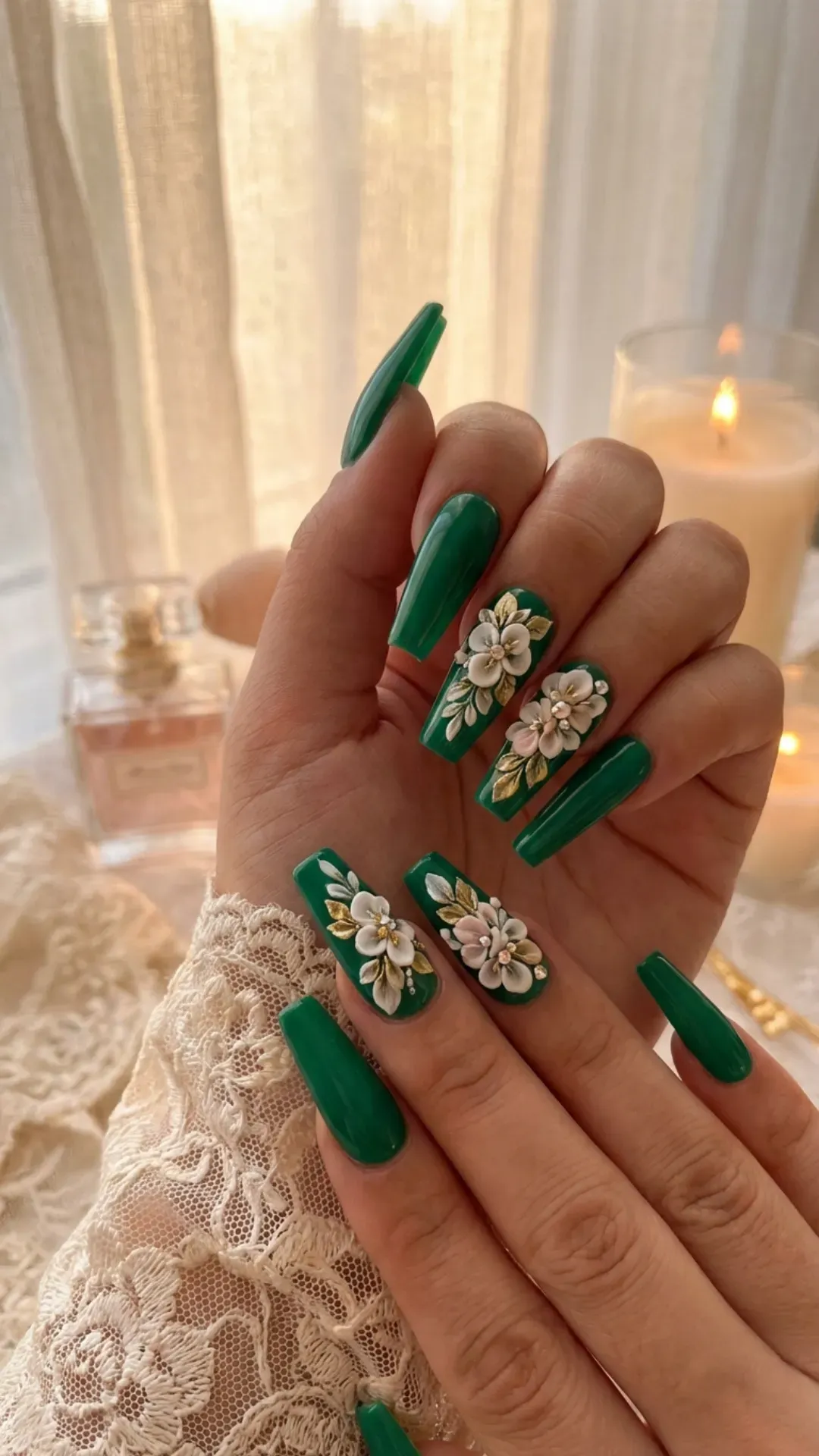 Glossy emerald green coffin nails with 3D white floral designs and gold leaf details