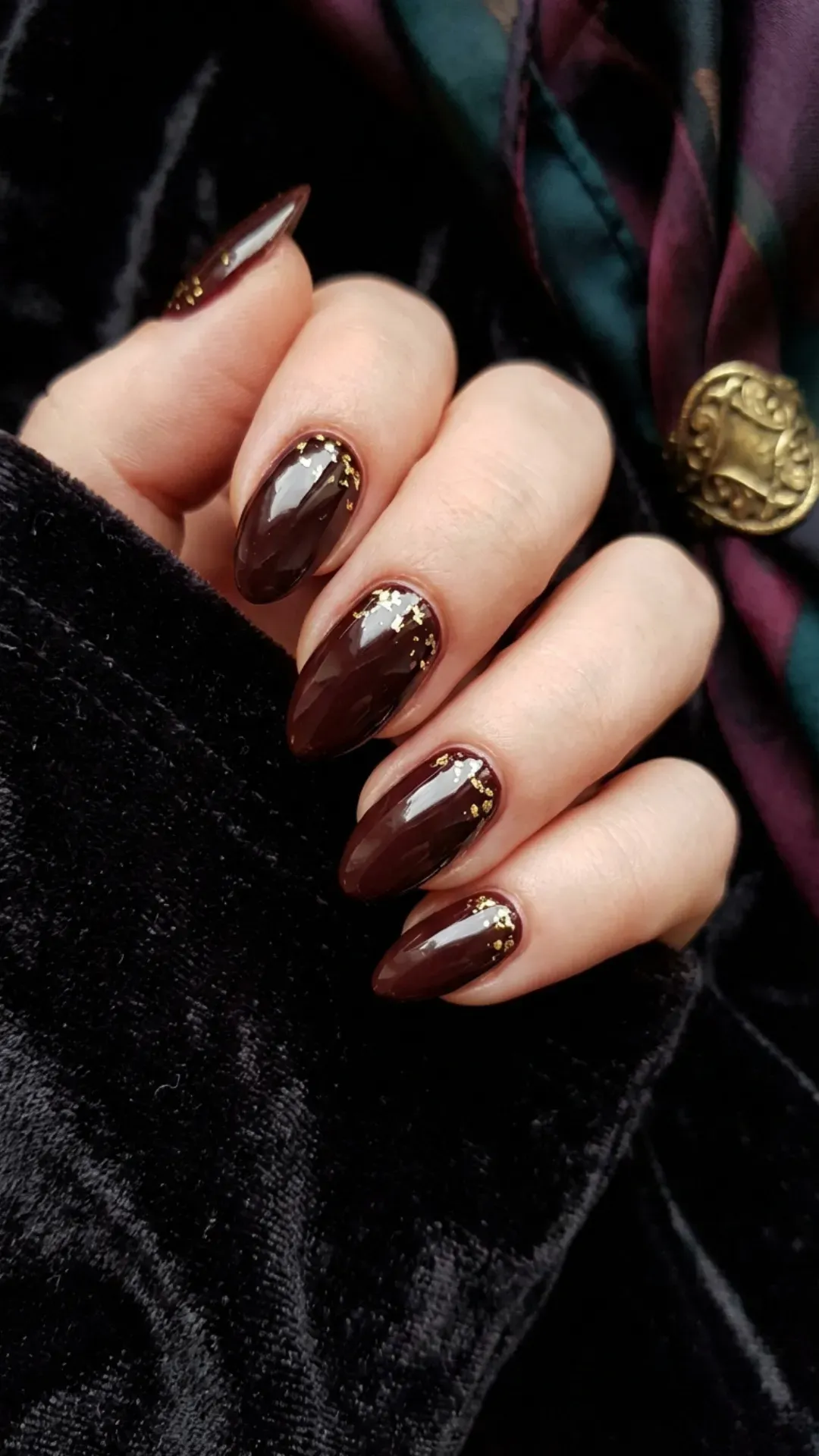 Deep cherry mocha nails encapsulated with gold leaf flakes VANSWEG.COM