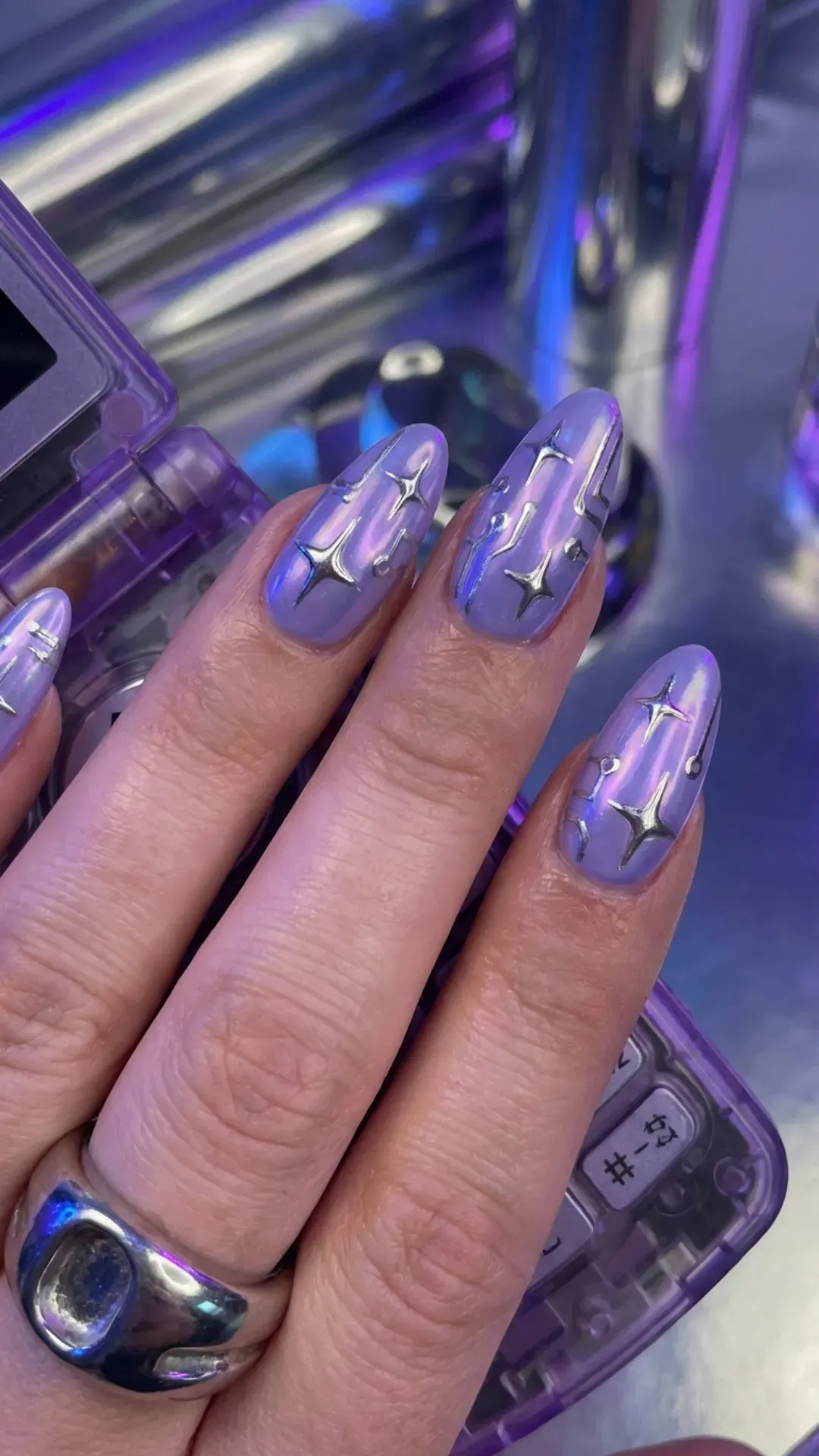 Digital lavender nails decorated with sharp silver chrome stars VANSWEG.COM
