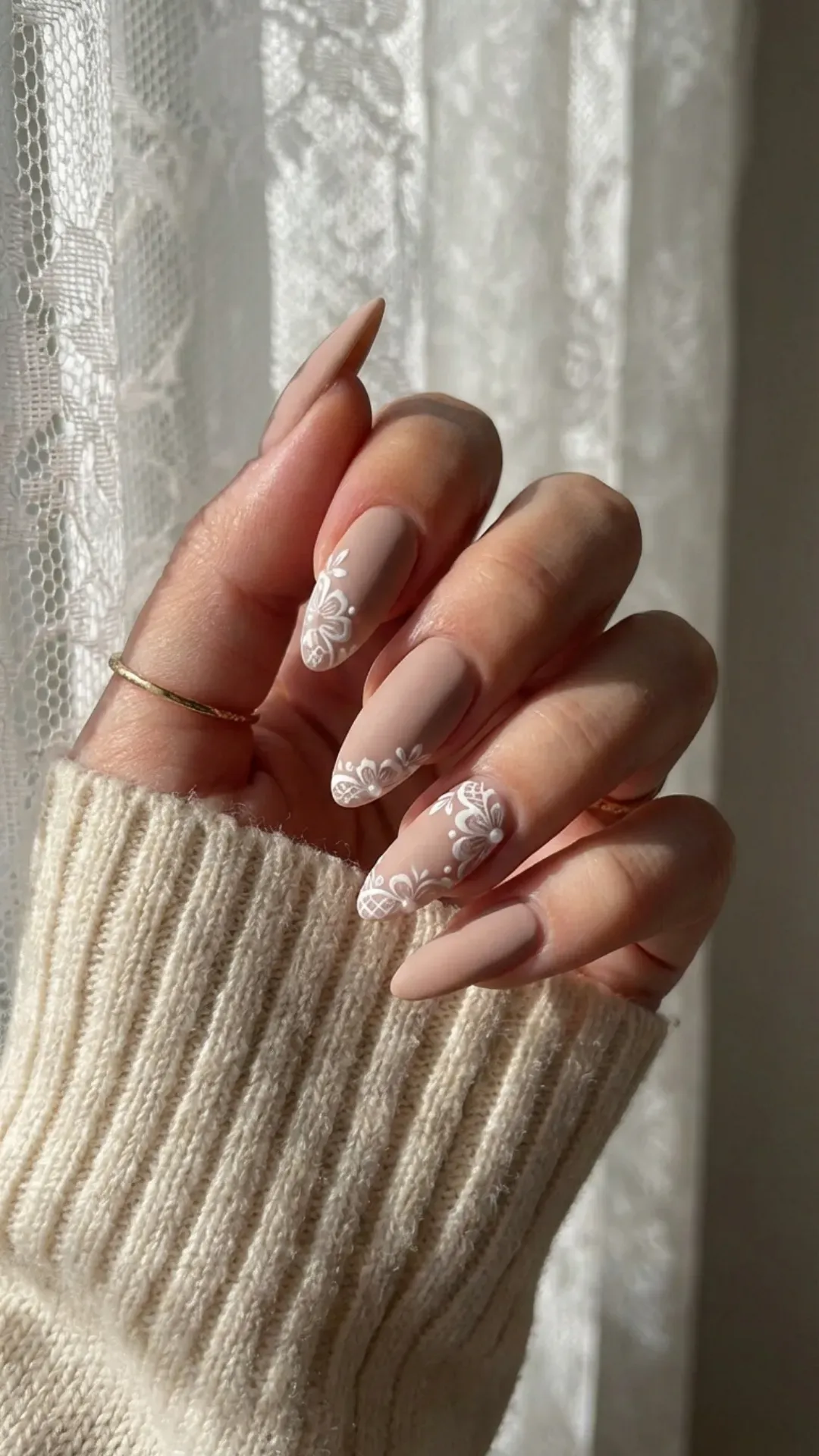 sheer nude nails with intricate white lace patterns by VANSWEG.COM