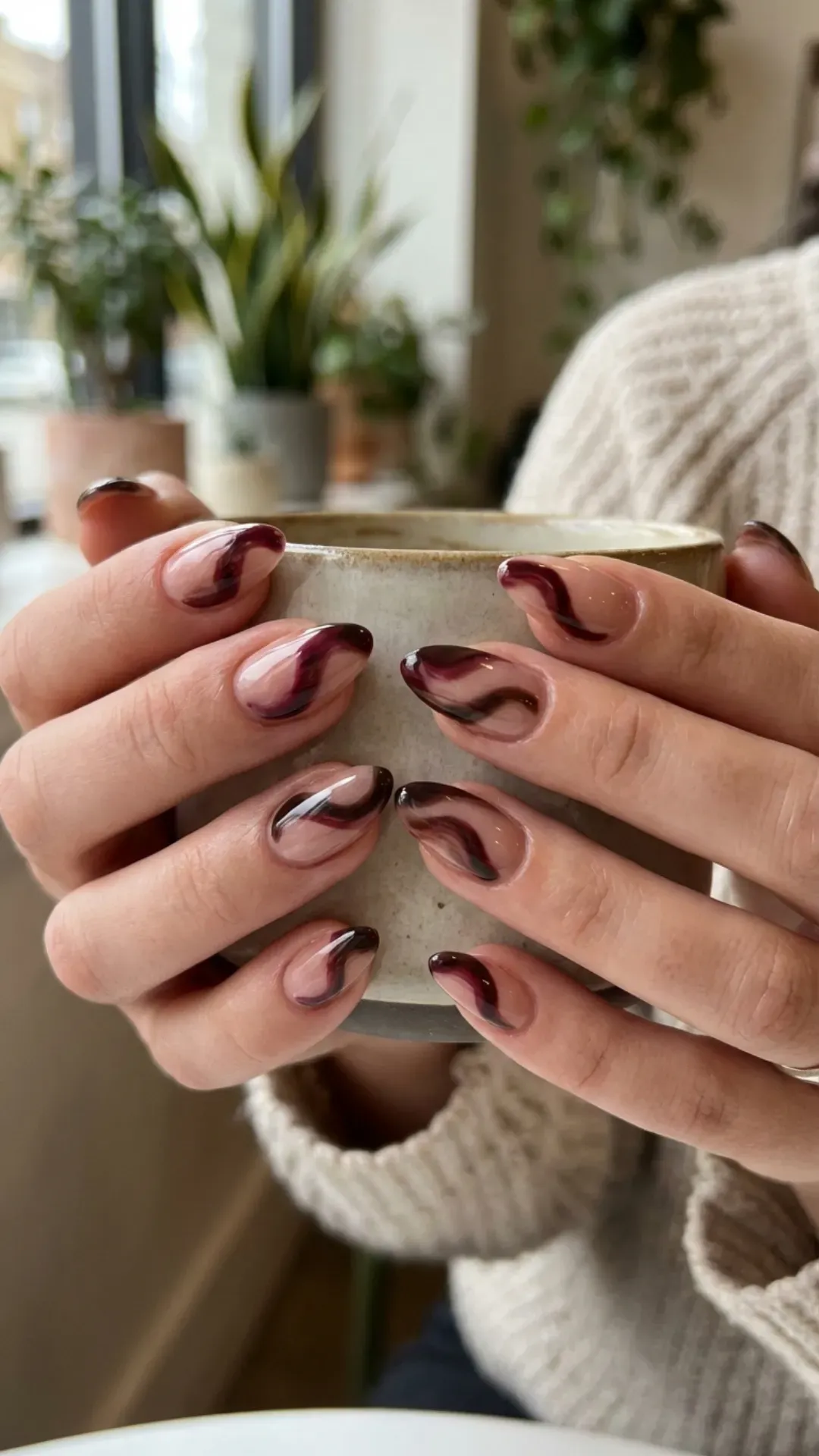 Dark cherry mocha and brown swirl nail art over nude base VANSWEG.COM