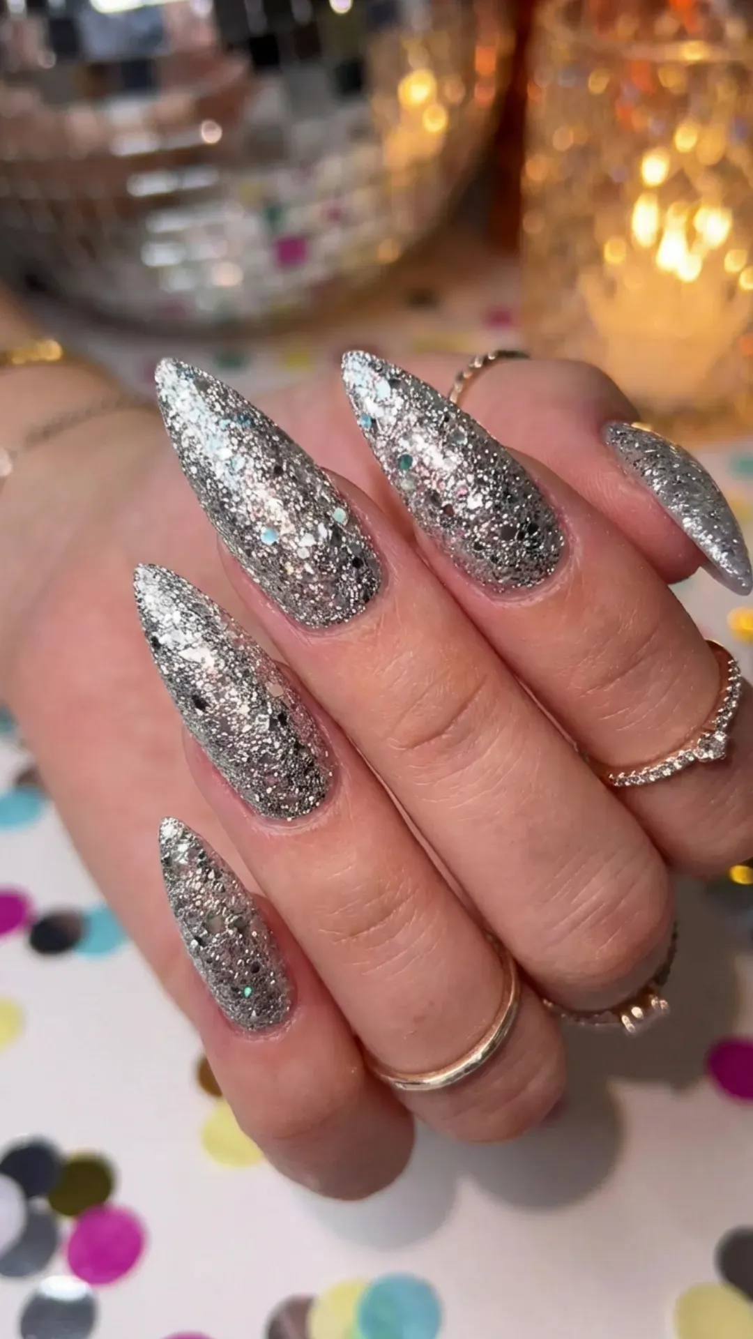 Silver glitter stiletto nails with full sparkle coverage