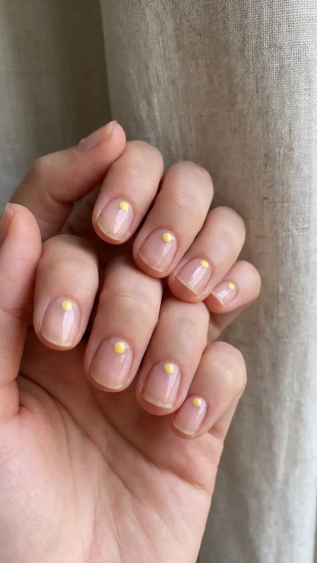 Sheer nails with a single minimalist butter yellow dot VANSWEG.COM