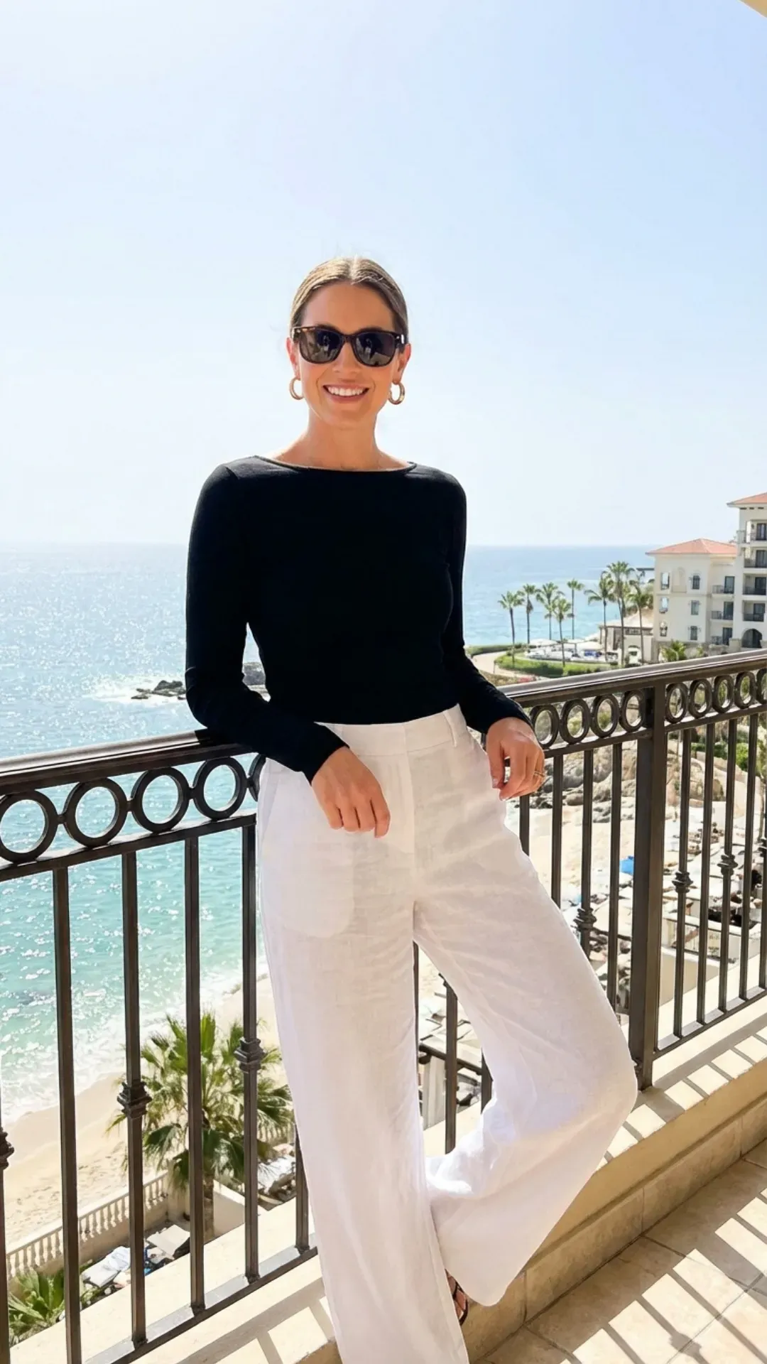 Wide-leg linen trousers and a fitted boatneck top for a classy summer look.