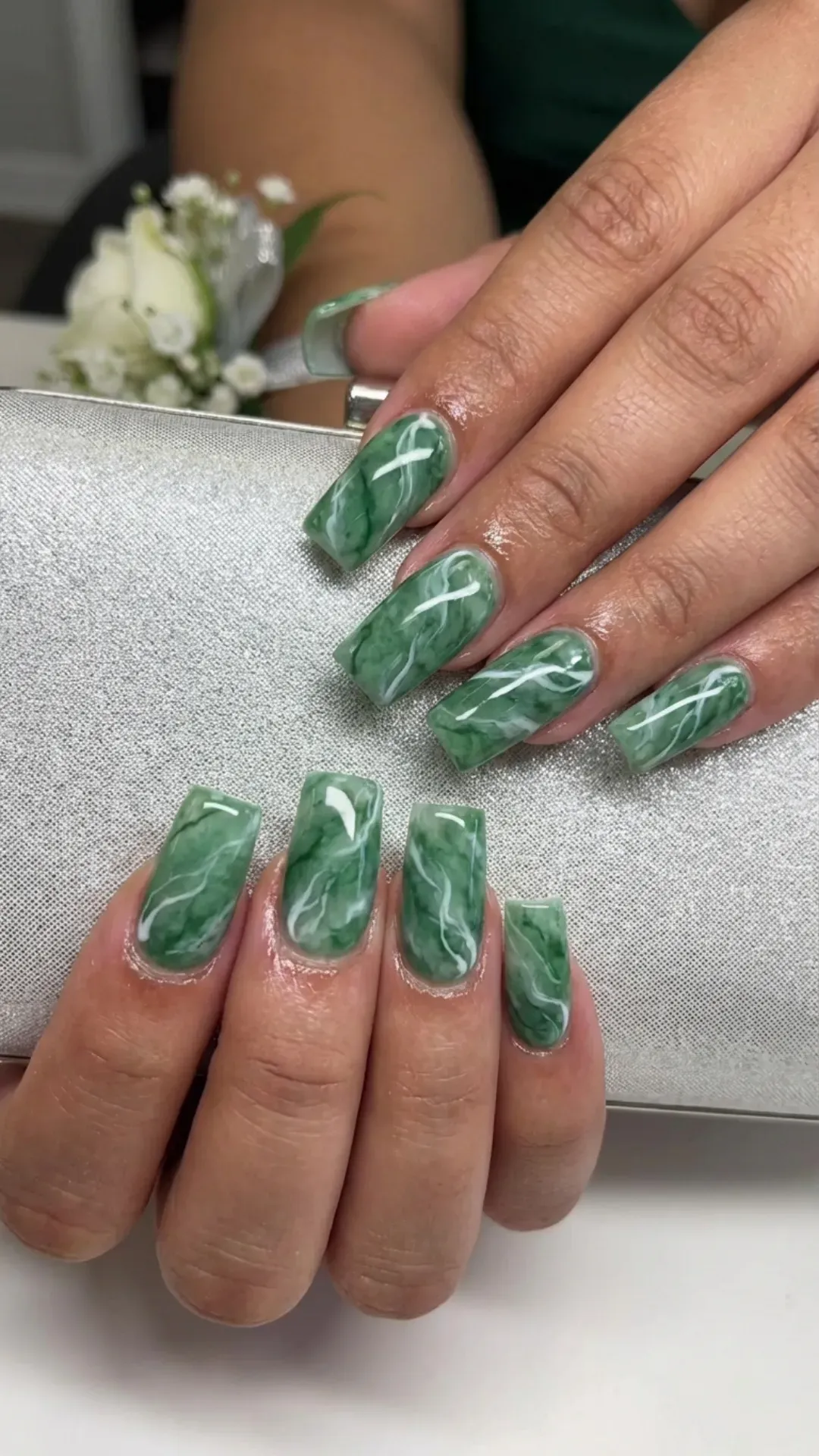 Green marble coffin nails with white veining and glossy finish