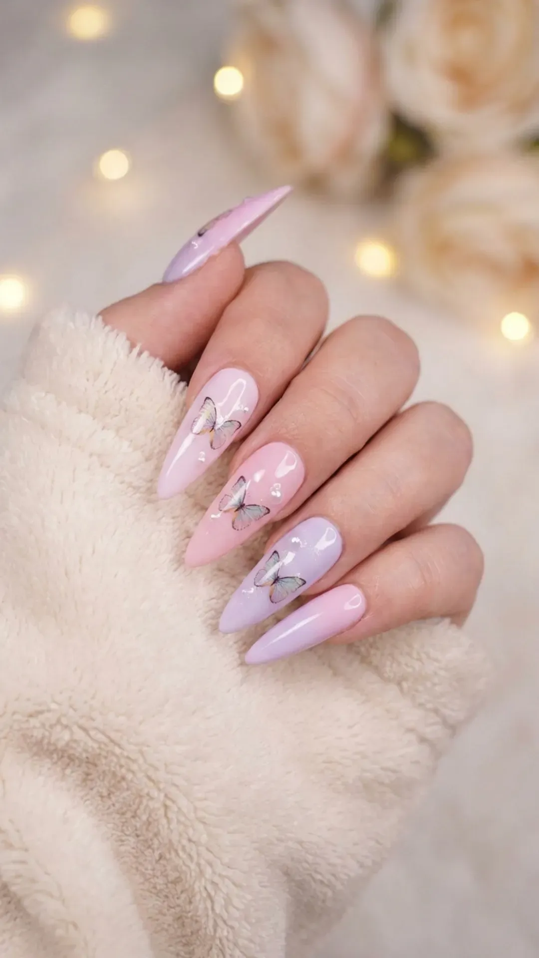 Stiletto nails decorated with butterfly designs