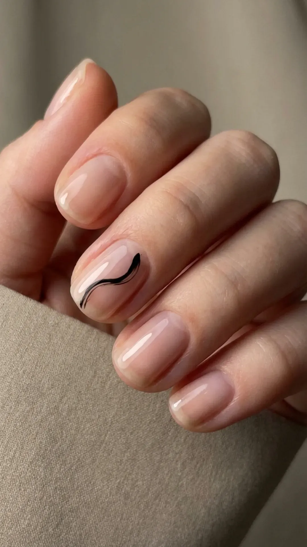 clear natural nails with a single sweeping black line by VANSWEG.COM
