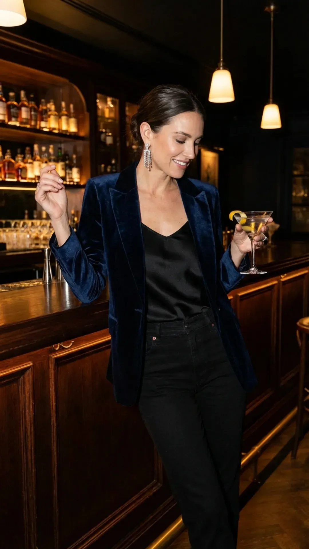 Midnight blue velvet blazer and black jeans for an elegant evening outfit.
