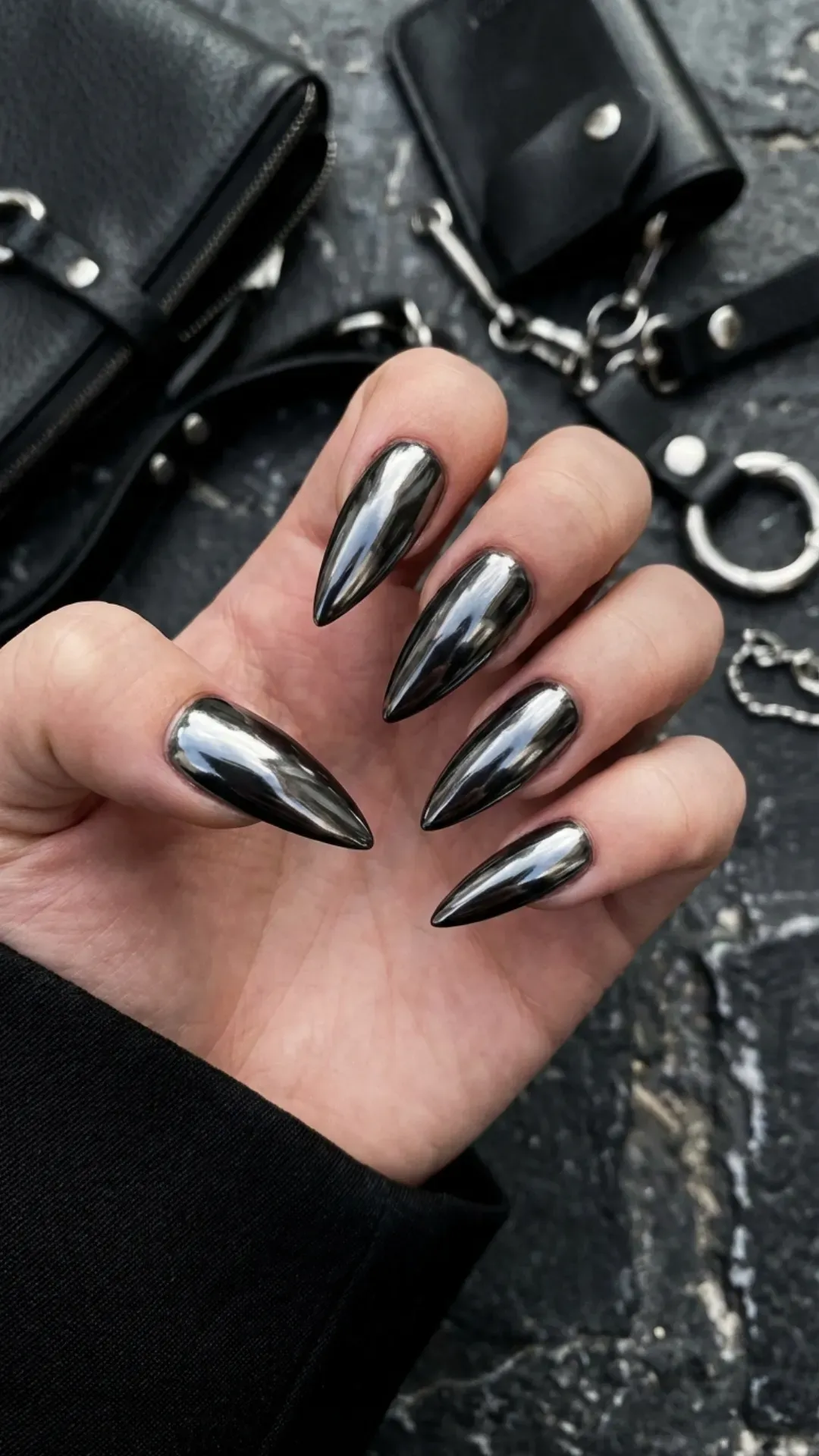 Gunmetal chrome stiletto nails with dark metallic shine