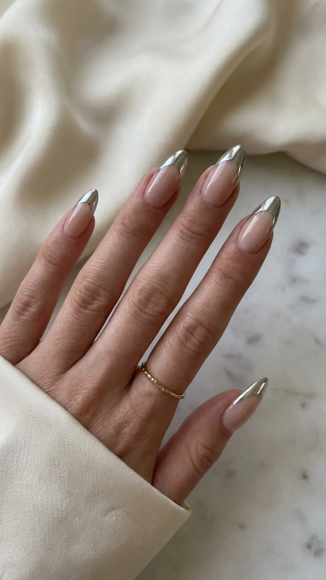 Nude stiletto nails with chrome French tips