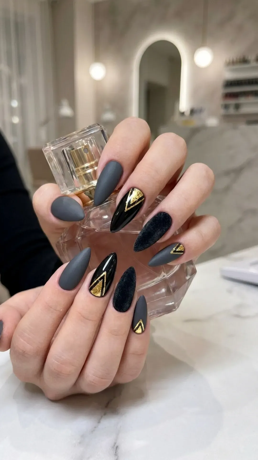 Mixed texture stiletto nails combining matte and glossy finishes