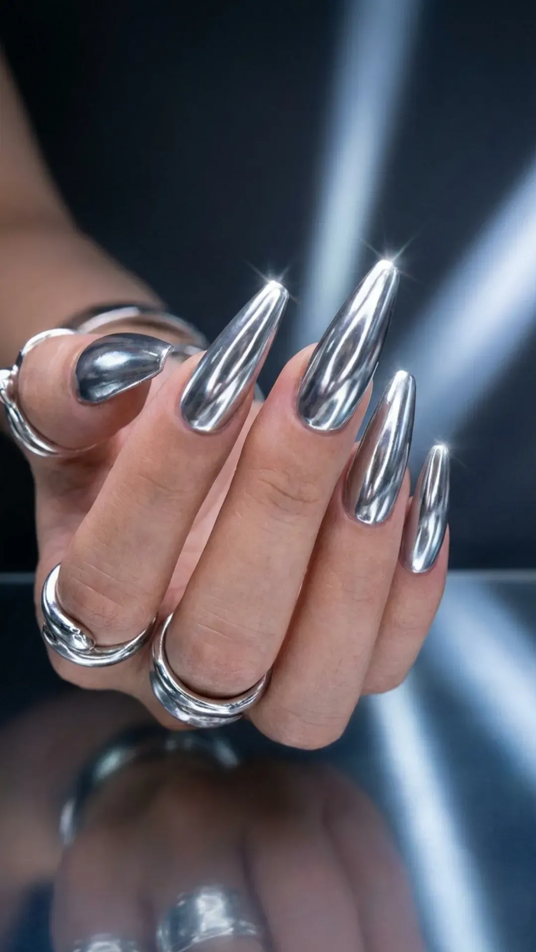 Silver chrome mirror prom nails, long stiletto shape, reflective glossy finish