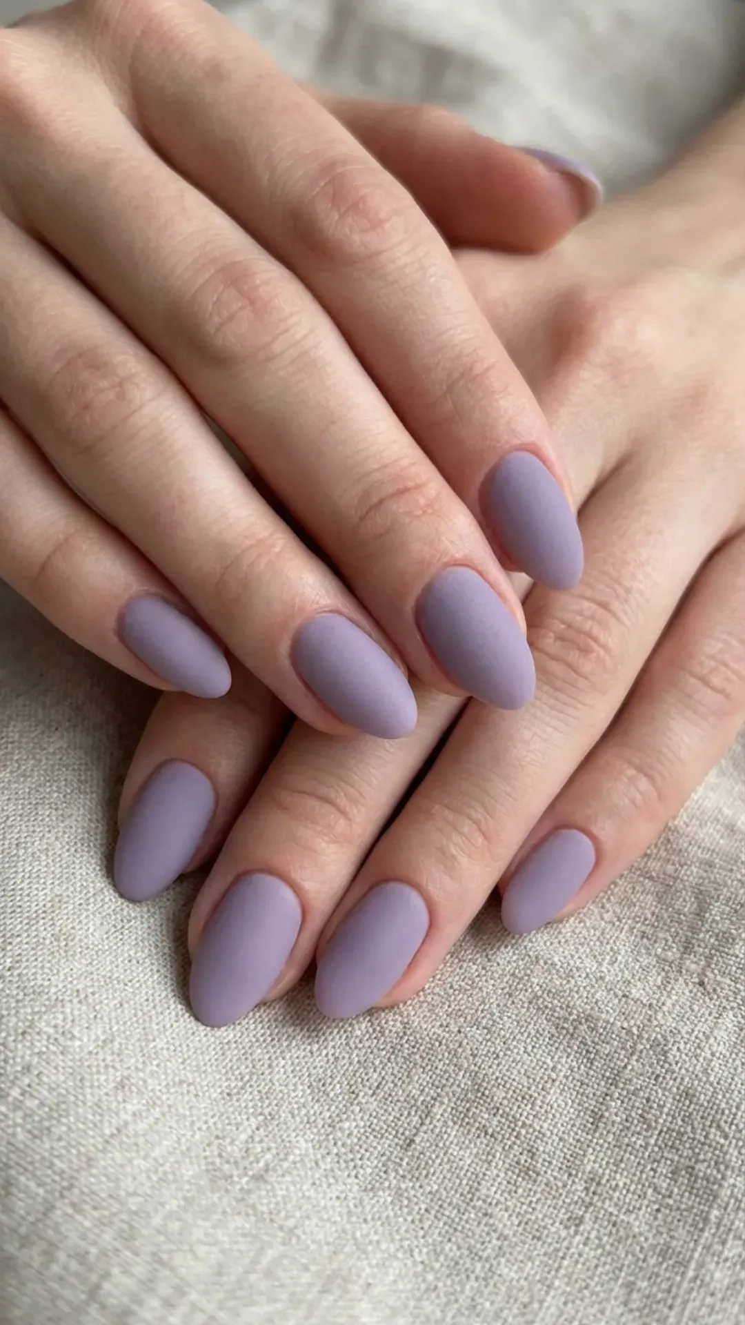 Matte lavender short nails with smooth velvety finish.
