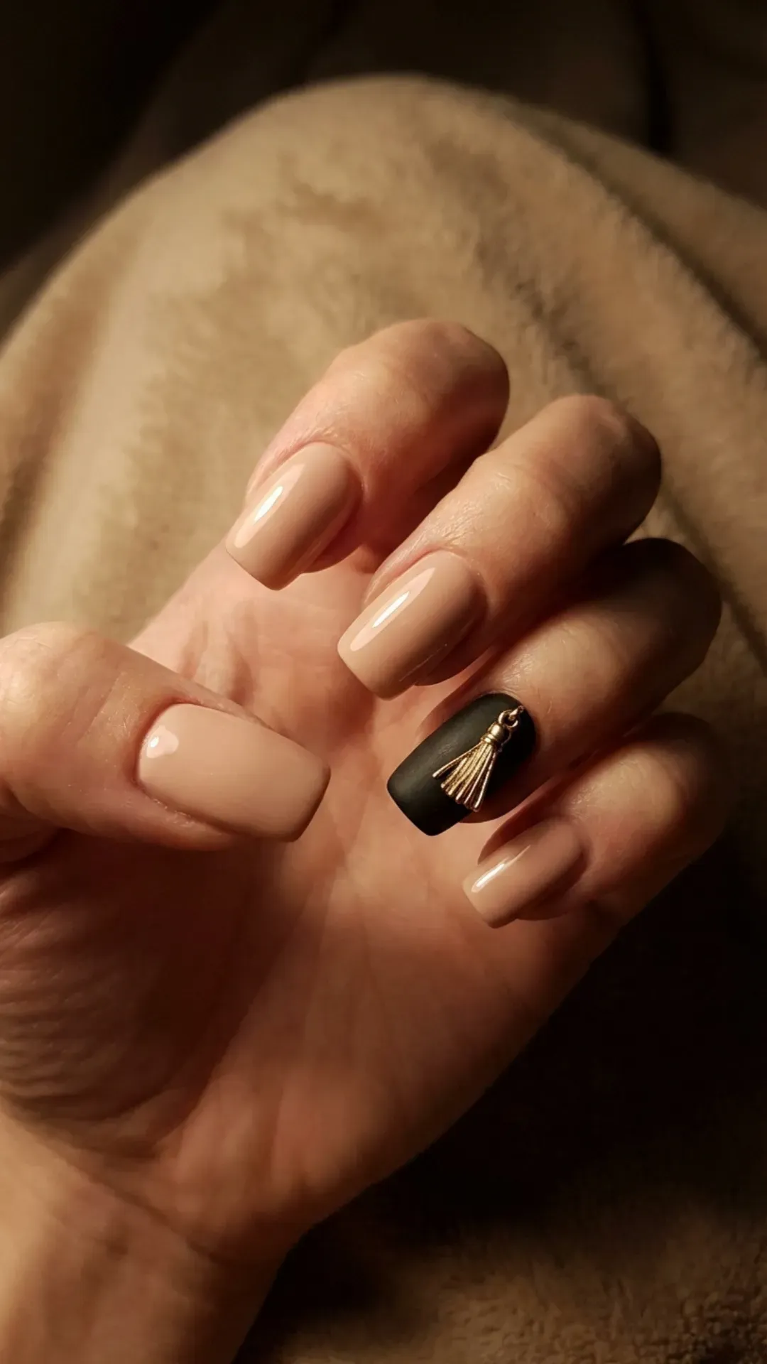 nude nails with matte black accent and gold tassel art by VANSWEG.COM
