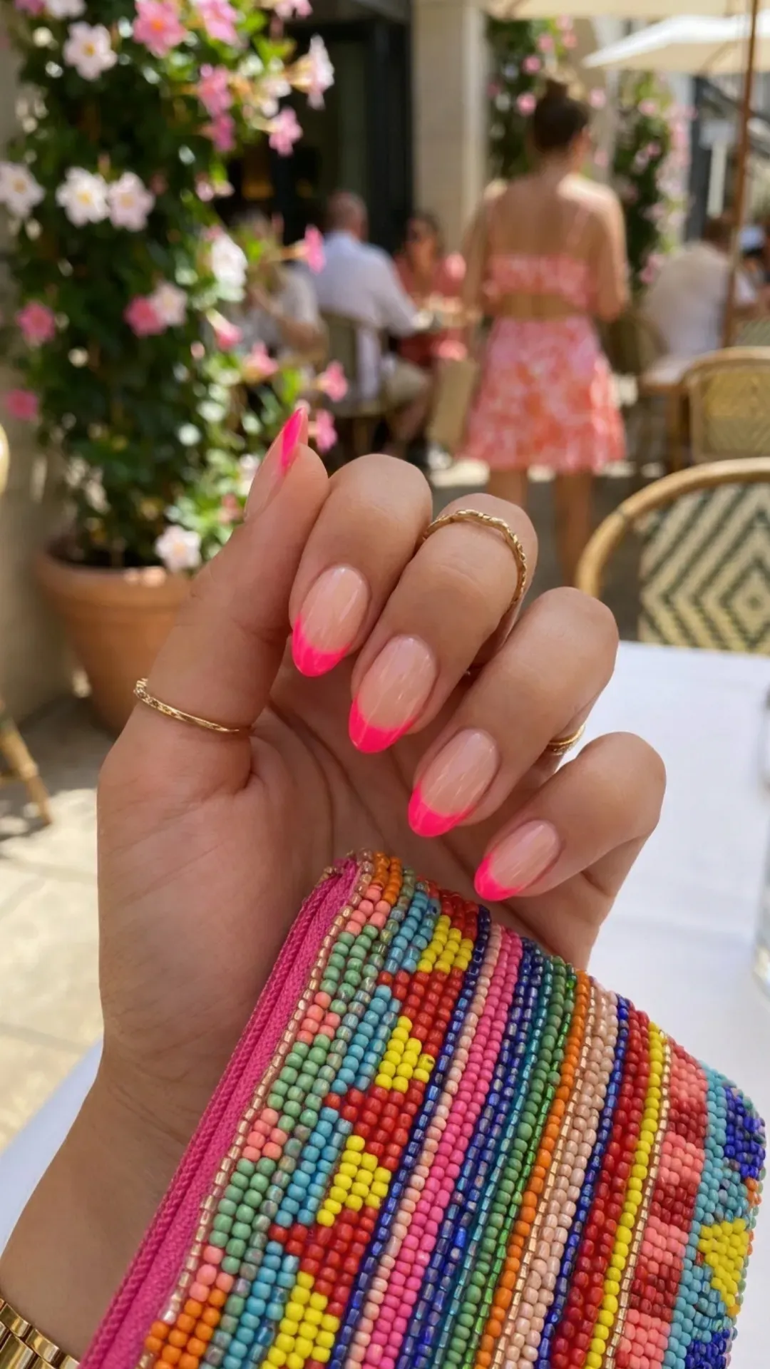 Vibrant and lively French manicure with a sheer base and striking neon pink tips, perfect for a standout summer look