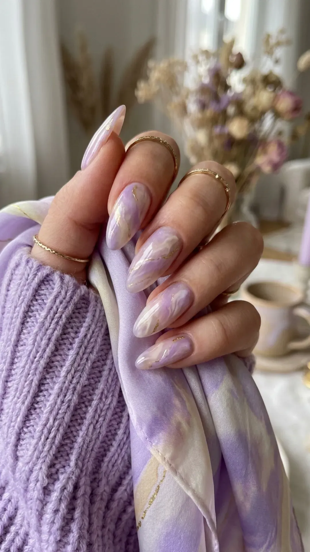 Dreamy lilac marble nail design with smooth swirls, ideal for adding a pop of color to your fashion ensemble.