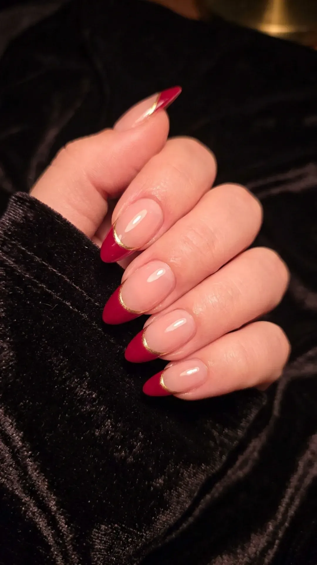 Contemporary and chic French nails with a sheer pink base and bold black tips, ideal for a minimalist aesthetic