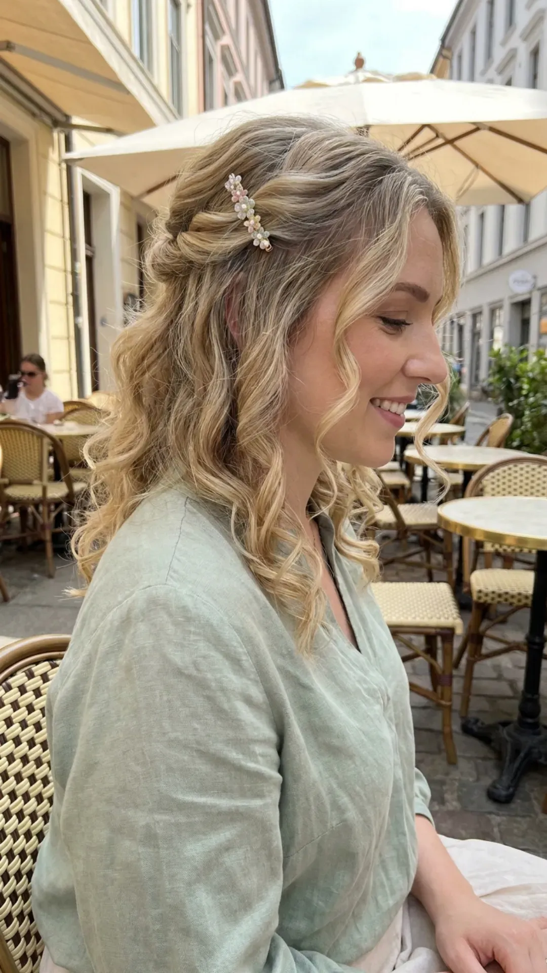 Side profile of a woman with a charming braid woven into a ponytail, adorned with pearl accessories, reflecting a graceful and intricate hairstyle ideal for springtime festivities.