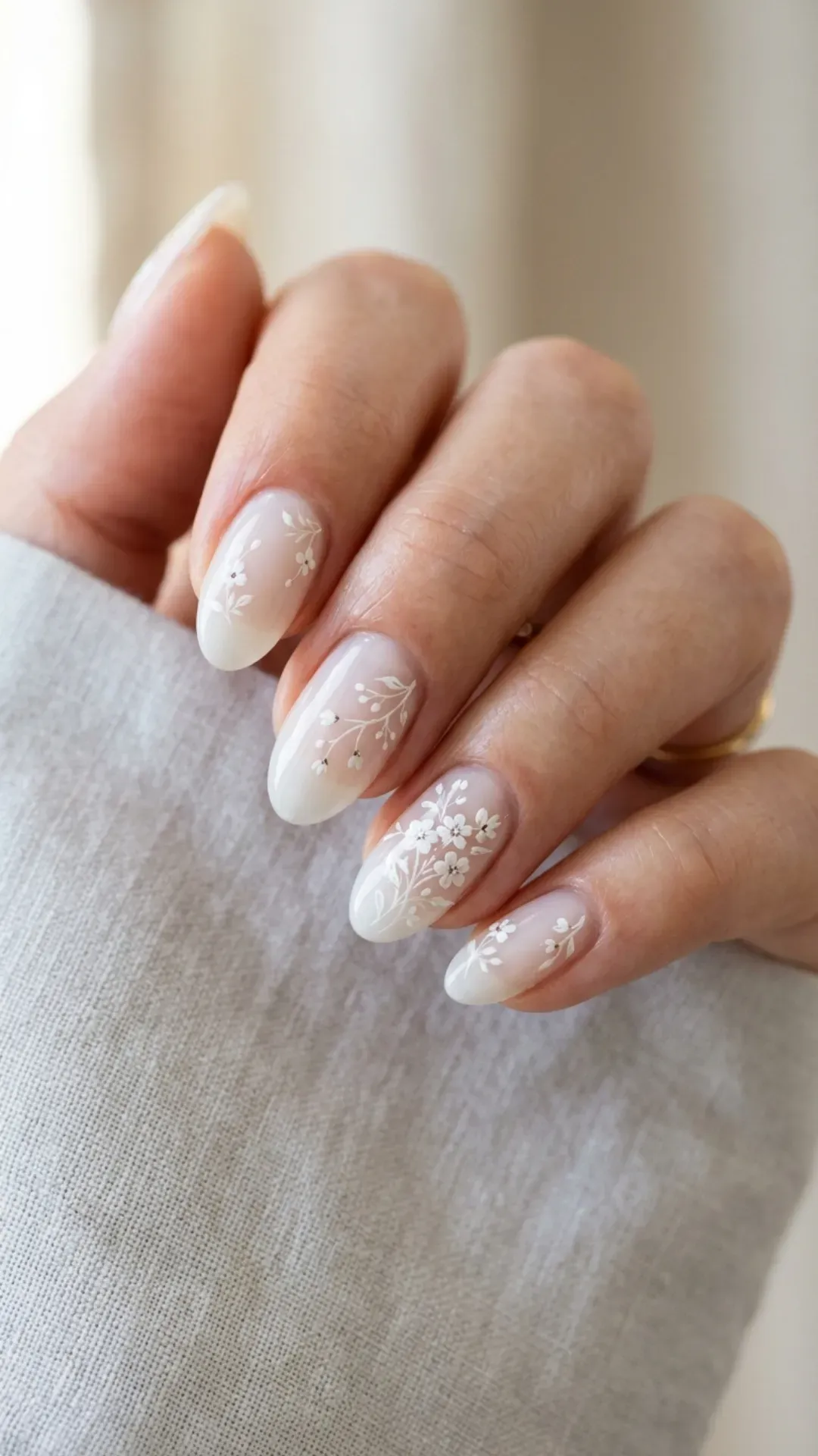 sheer cloud dancer nails with tiny monochromatic white floral nail art by VANSWEG.COM