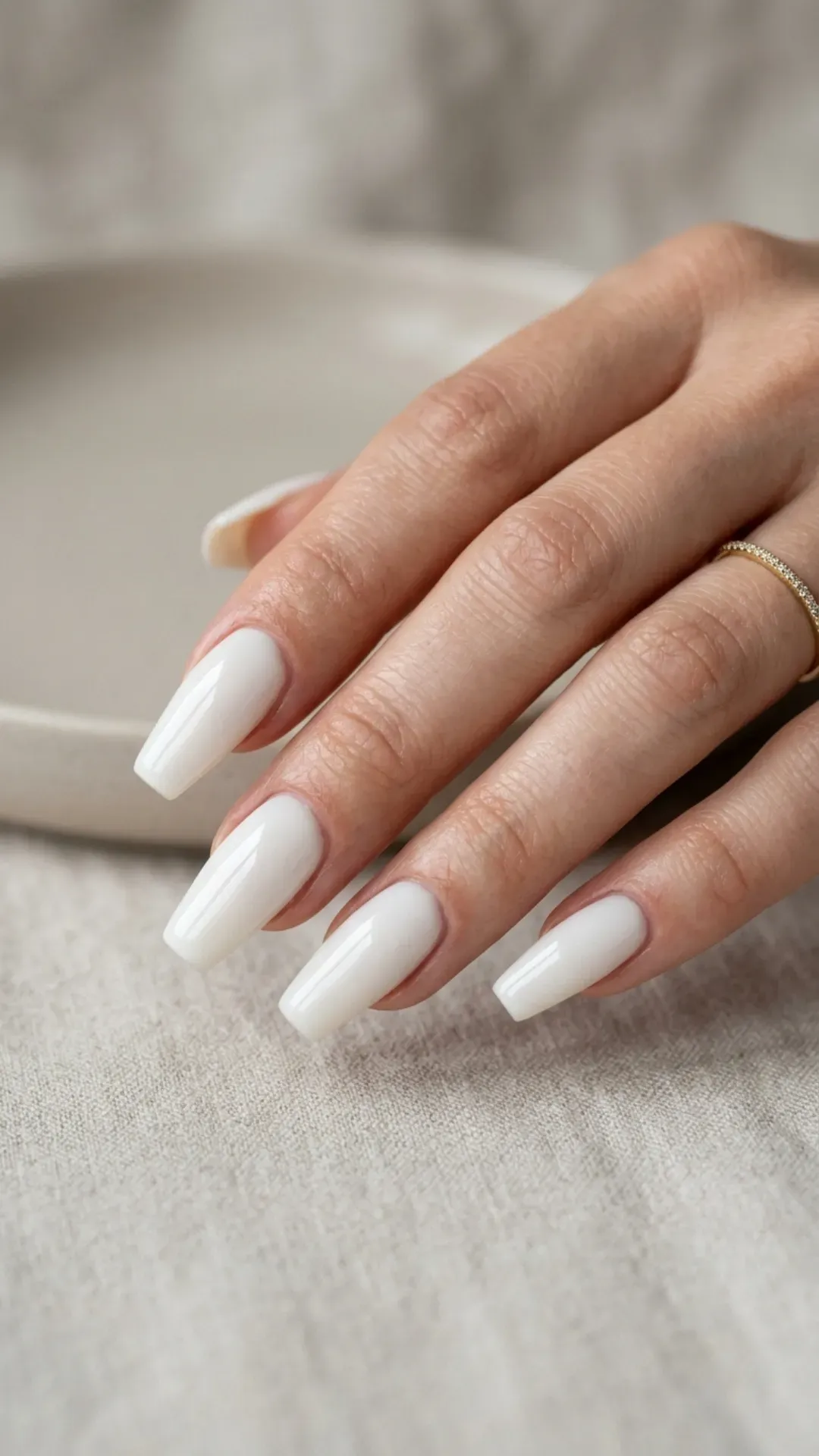  sleek coffin shaped nails painted in glossy cloud dancer by VANSWEG.COM