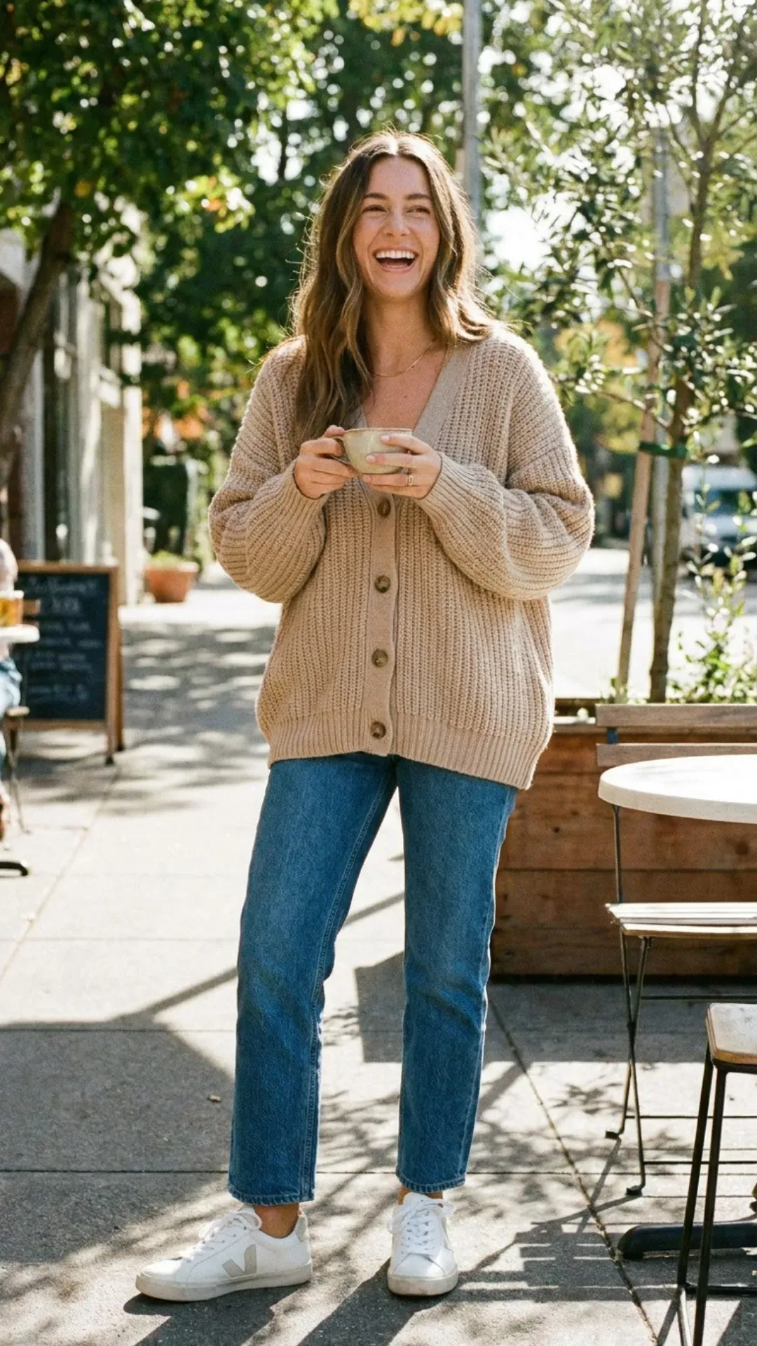 Oversized beige cardigan and straight-leg jeans for a cute casual outfit.