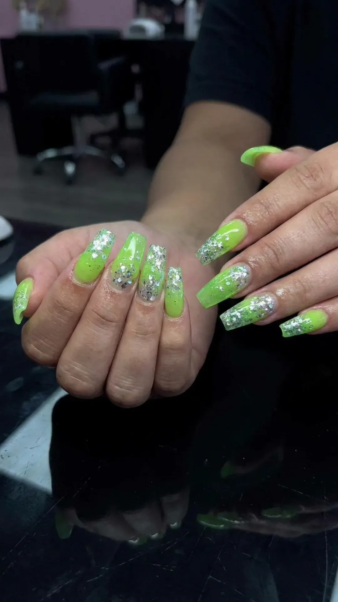 neon green syrup nails topped with silver glitter