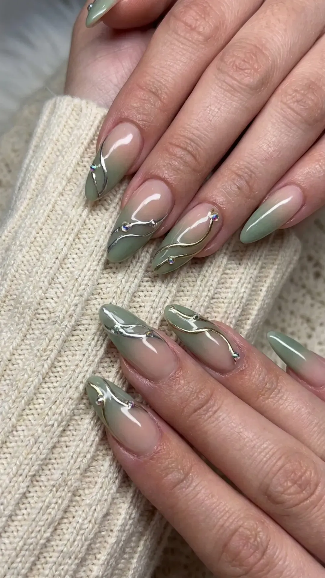 Sage Green Ombre Nails with Chrome Accents - Nude to sage ombre nails with chrome abstract lines and gems