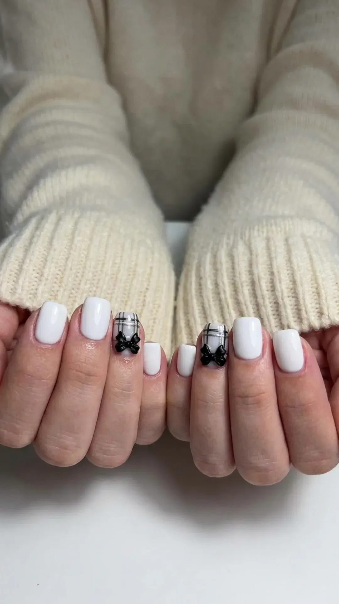 White Nails with Plaid and Bow Art - Chic white nails featuring hand-drawn plaid and bow designs