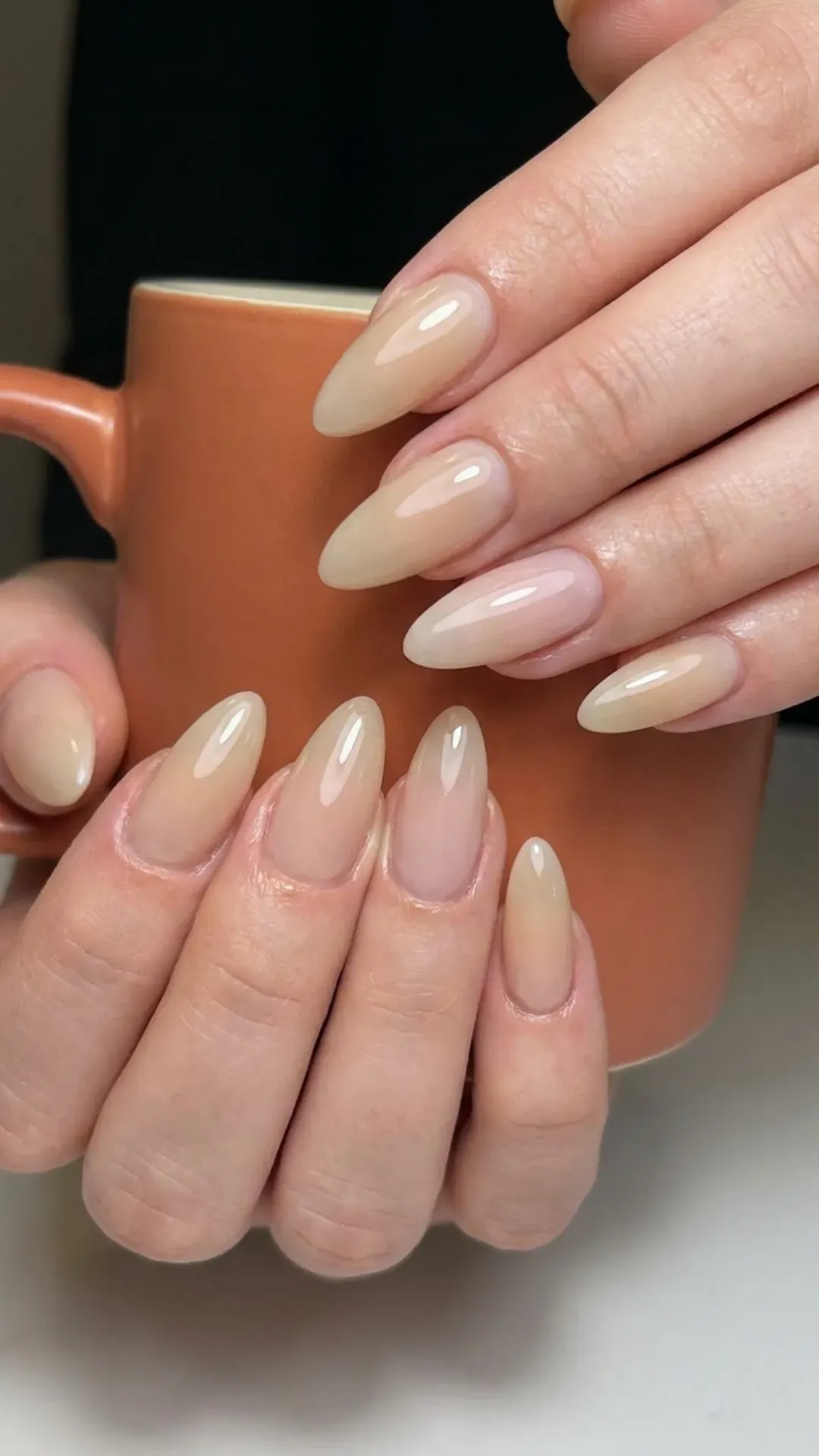 Nude Milky Syrup Nails - Glossy nude syrup nails on almond-shaped tips