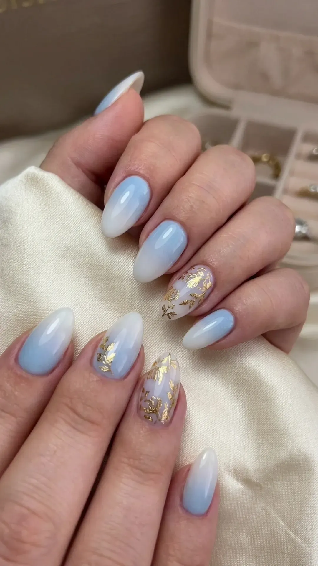 Light Blue Ombre Nails with Gold Accents - Elegant white ombre nails with gold foil floral patterns