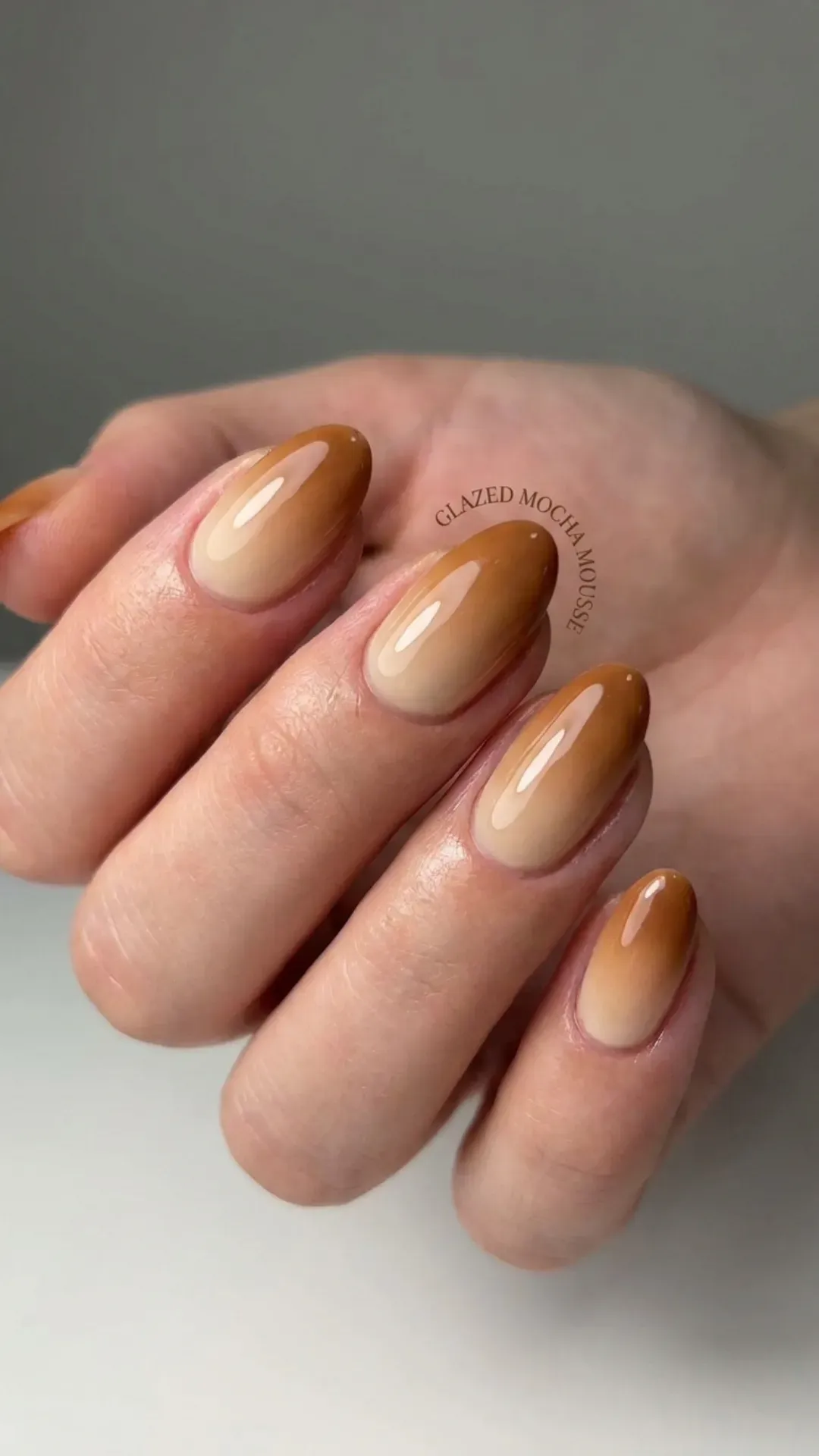 Glazed Mocha Mousse Nails - Short almond nails with glossy nude-to-caramel gradient
